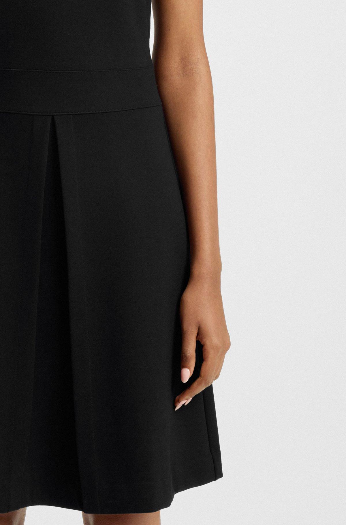 Sleeveless knitted dress with pleated skirt Product Image