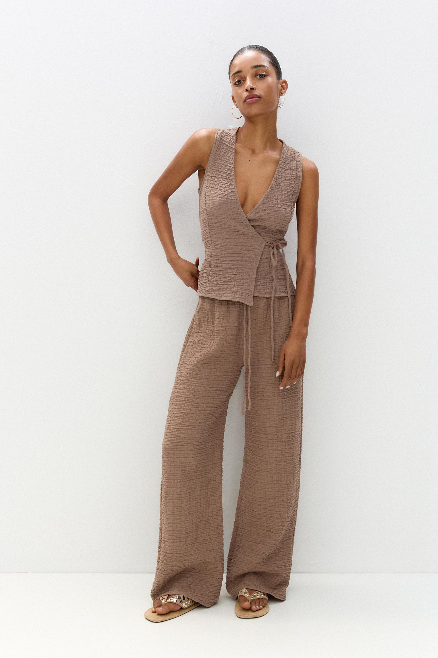 Rustic creased-effect pants Product Image