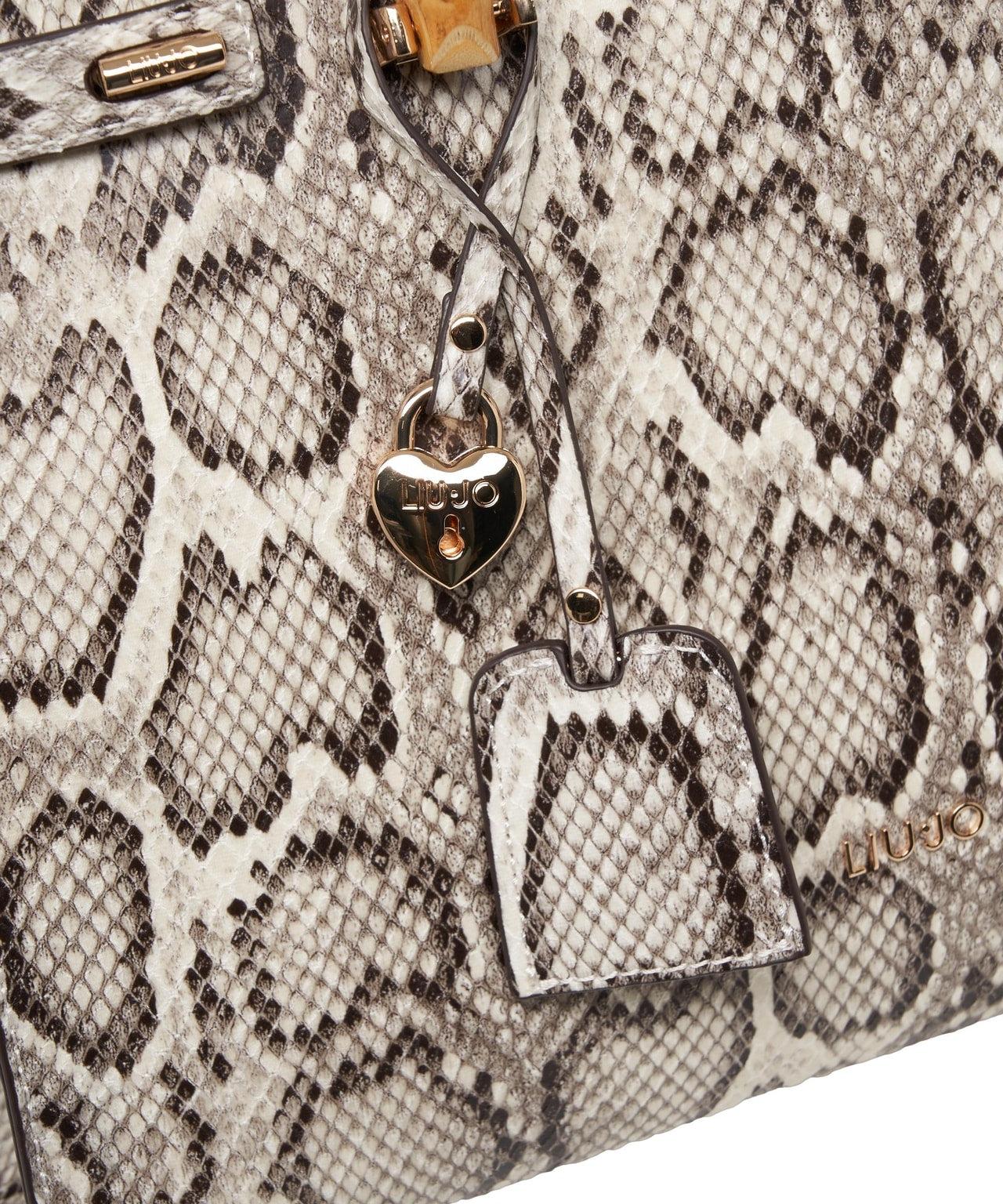 Hand bag with snake pattern Product Image