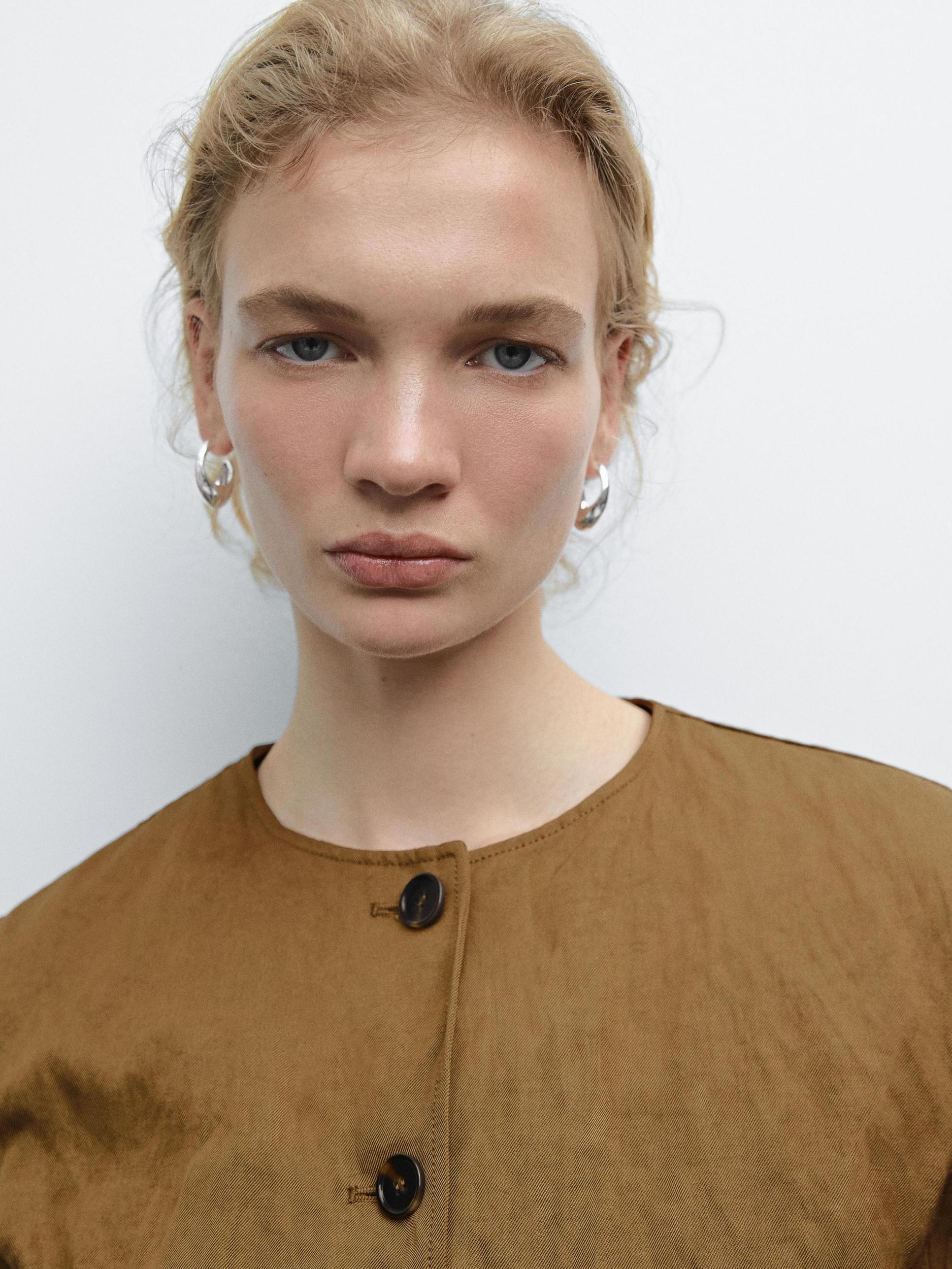 Short jacket with fabric detail Product Image