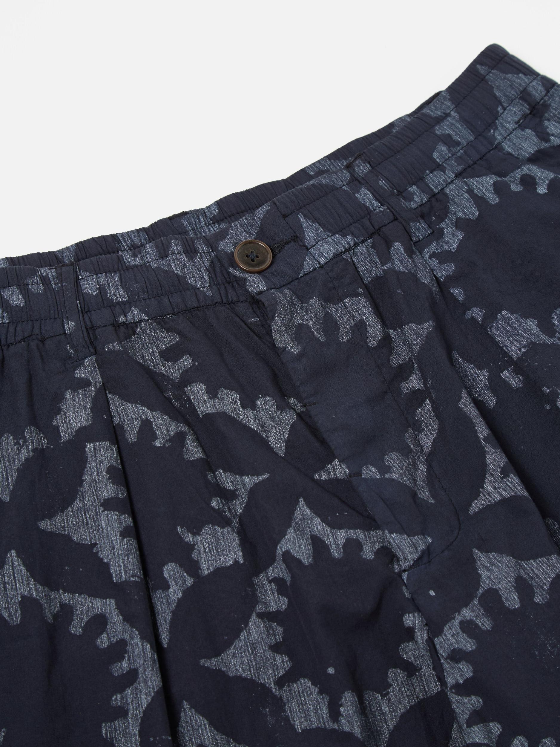 Universal Works Pleated Track Short in Navy Over Dyed Sun Print Product Image