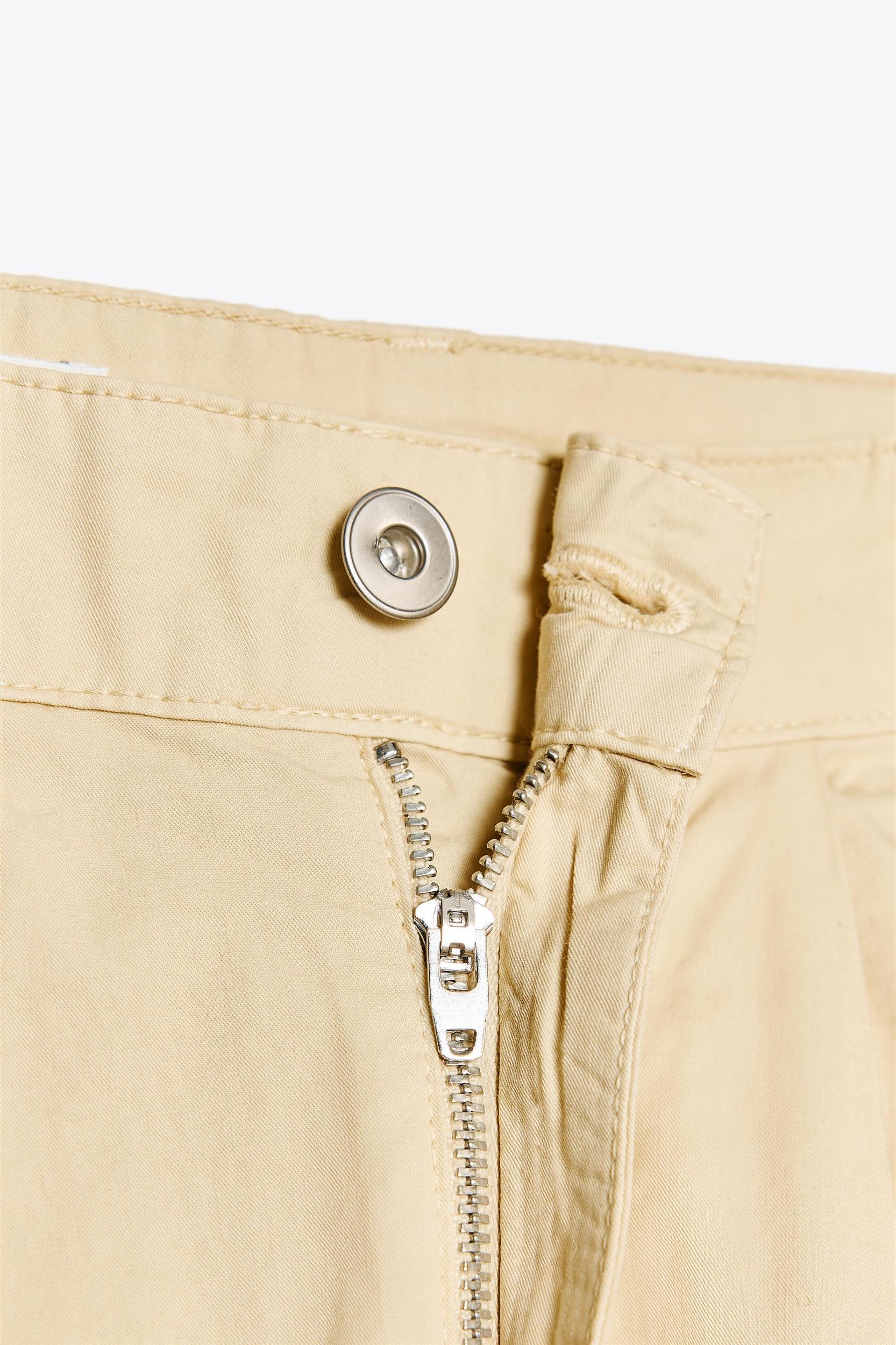 PLEATED BELTED PANTS Product Image
