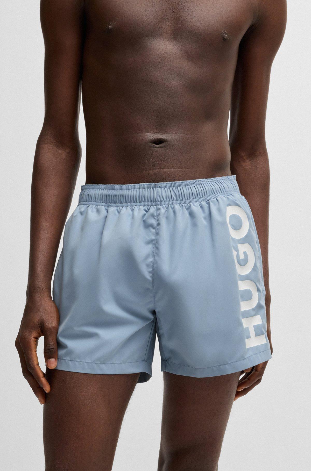 HUGO - Quick-dry swim shorts with vertical logo print - Light Blue Product Image