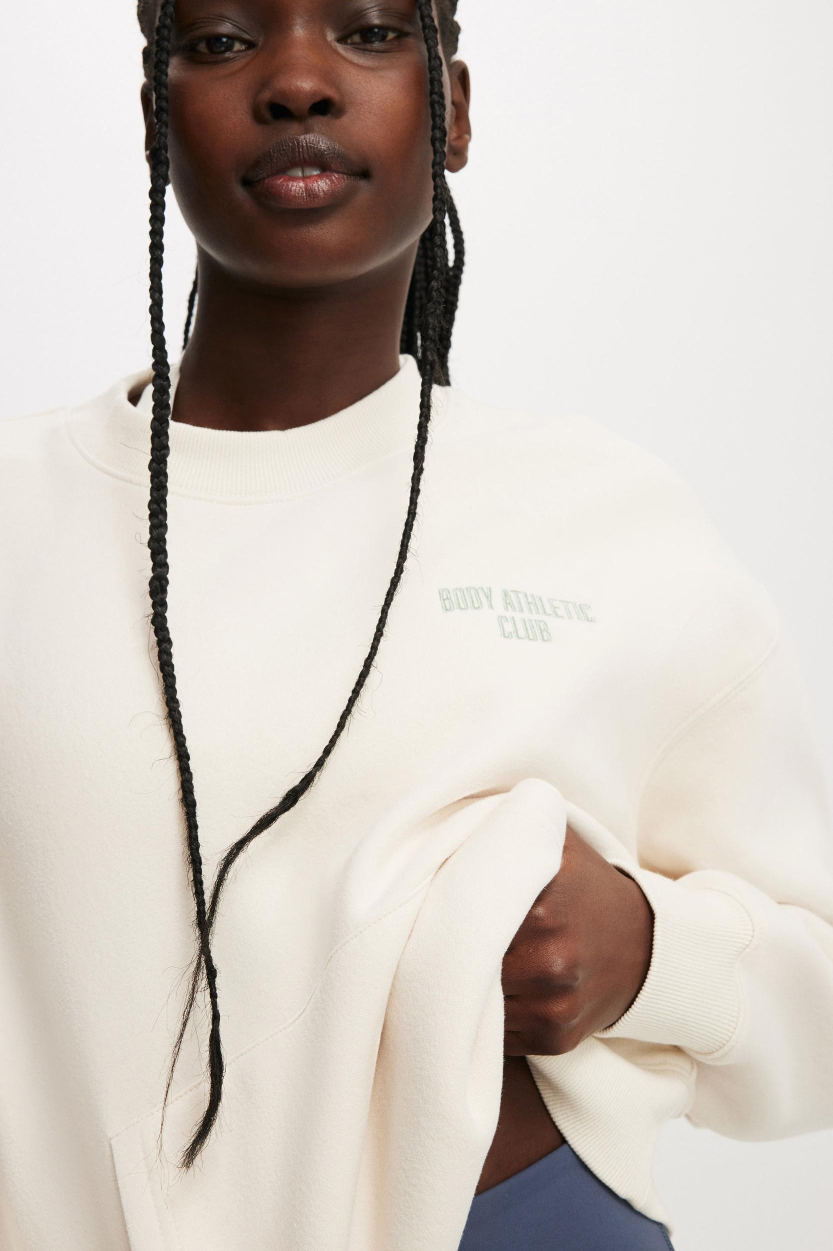 Plush Graphic Pocket Crew Sweatshirt Product Image