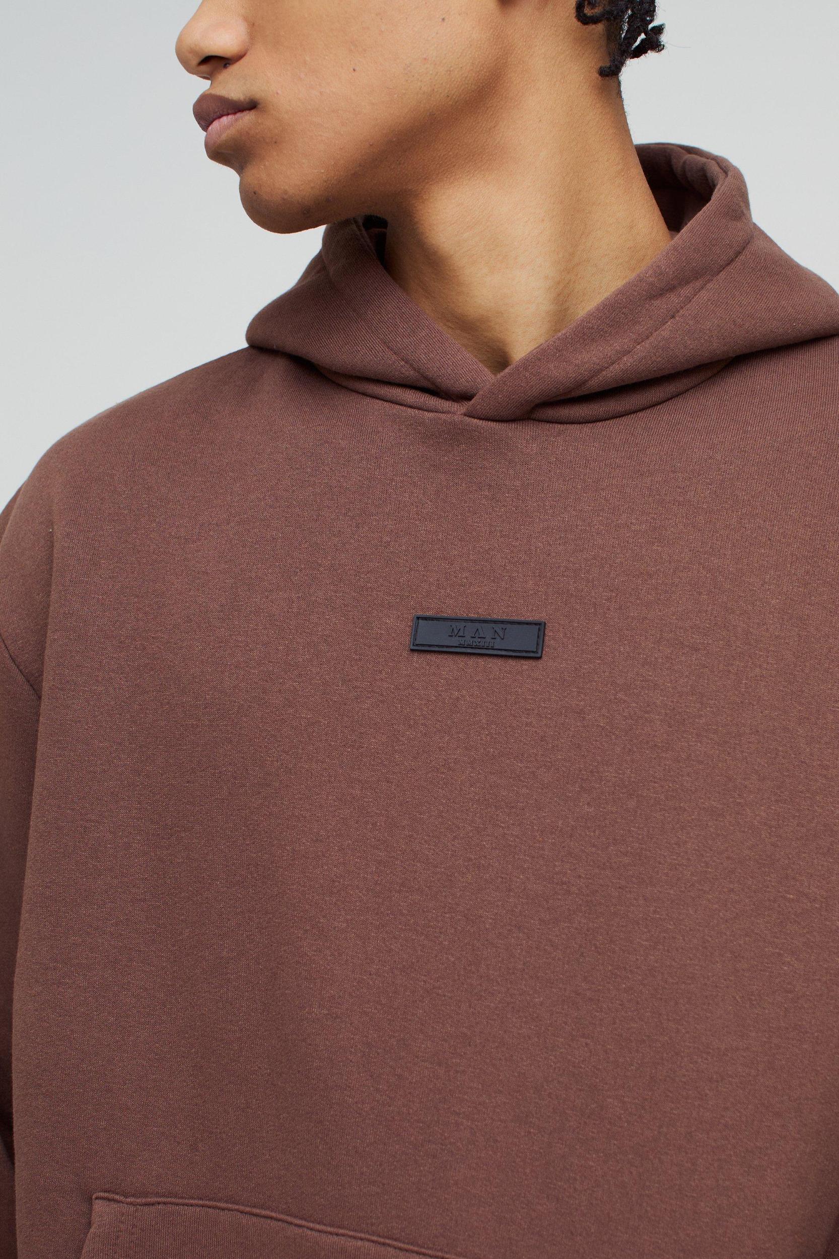 Oversized Boxy Wide Leg Hooded Tracksuit With Rubber Badge | boohooMAN USA Product Image