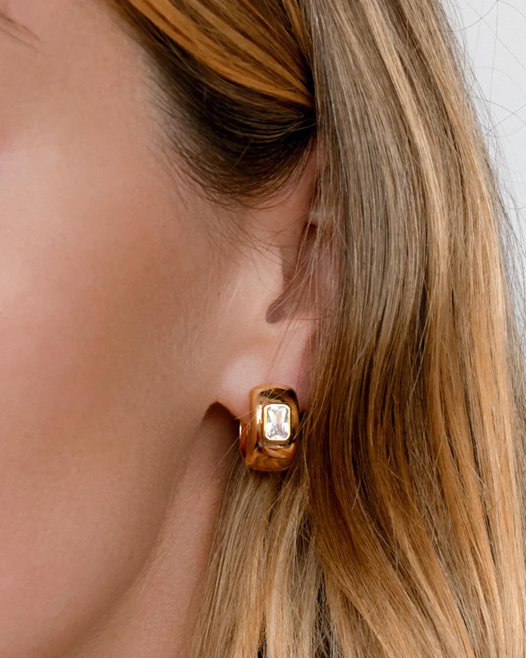 LUV AJ | The Emerald Bezel Stone Huggies Product Image