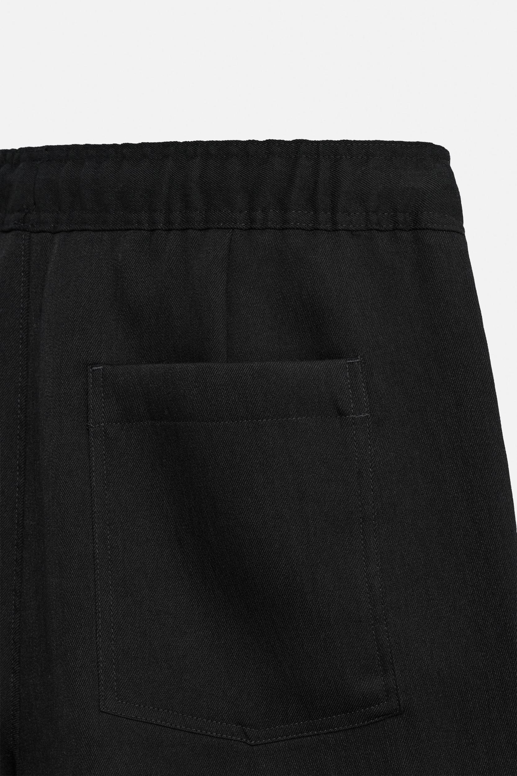 PLEATED FLOWY SHORTS Product Image