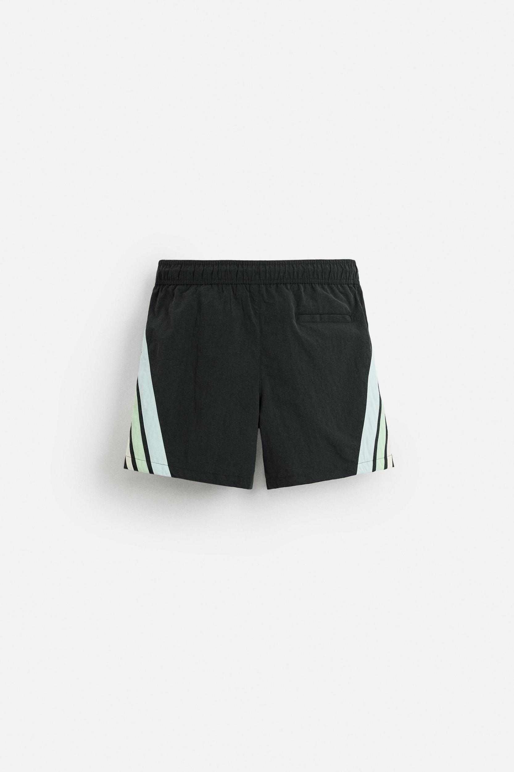 CONTRAST BANDS MID-LENGTH SWIMSUIT Product Image