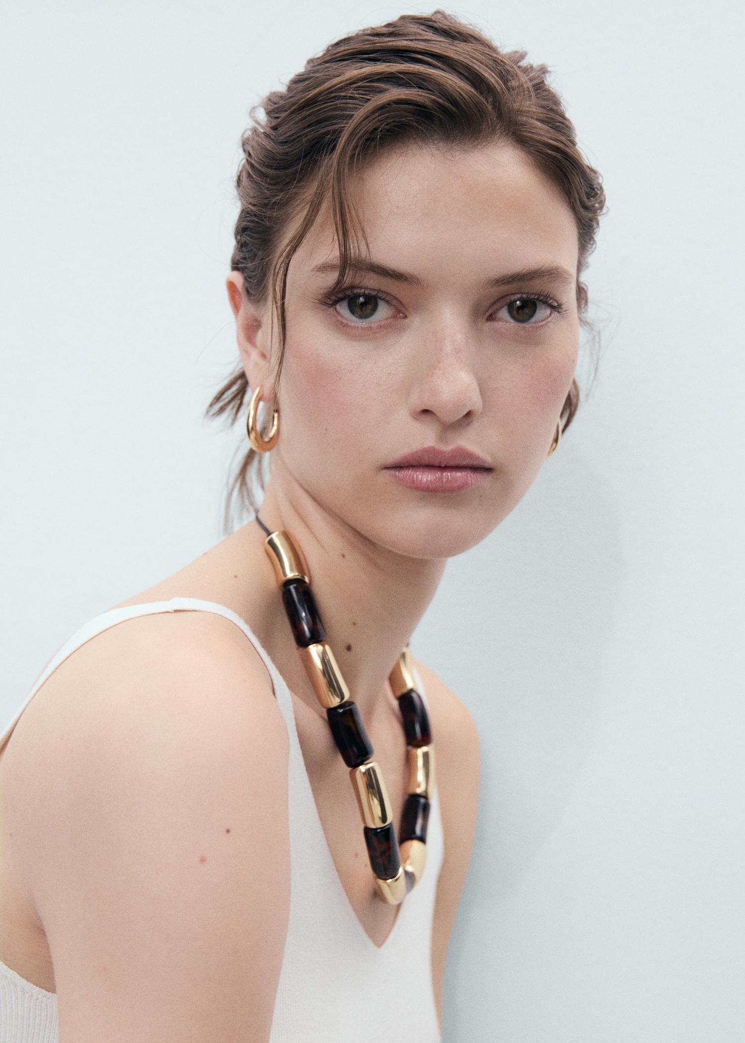 V-neck knitted top - Women | MANGO USA Product Image