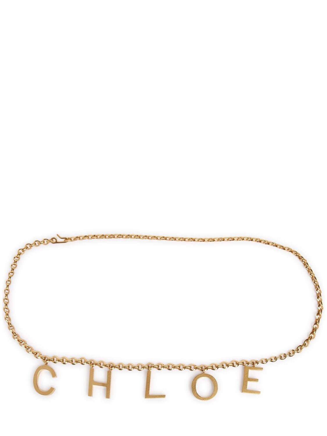 CHLOÉ Metallic Belt With Adjustable Hook Closure And Logo Lettering Charm In Brass Woman In Gold Product Image