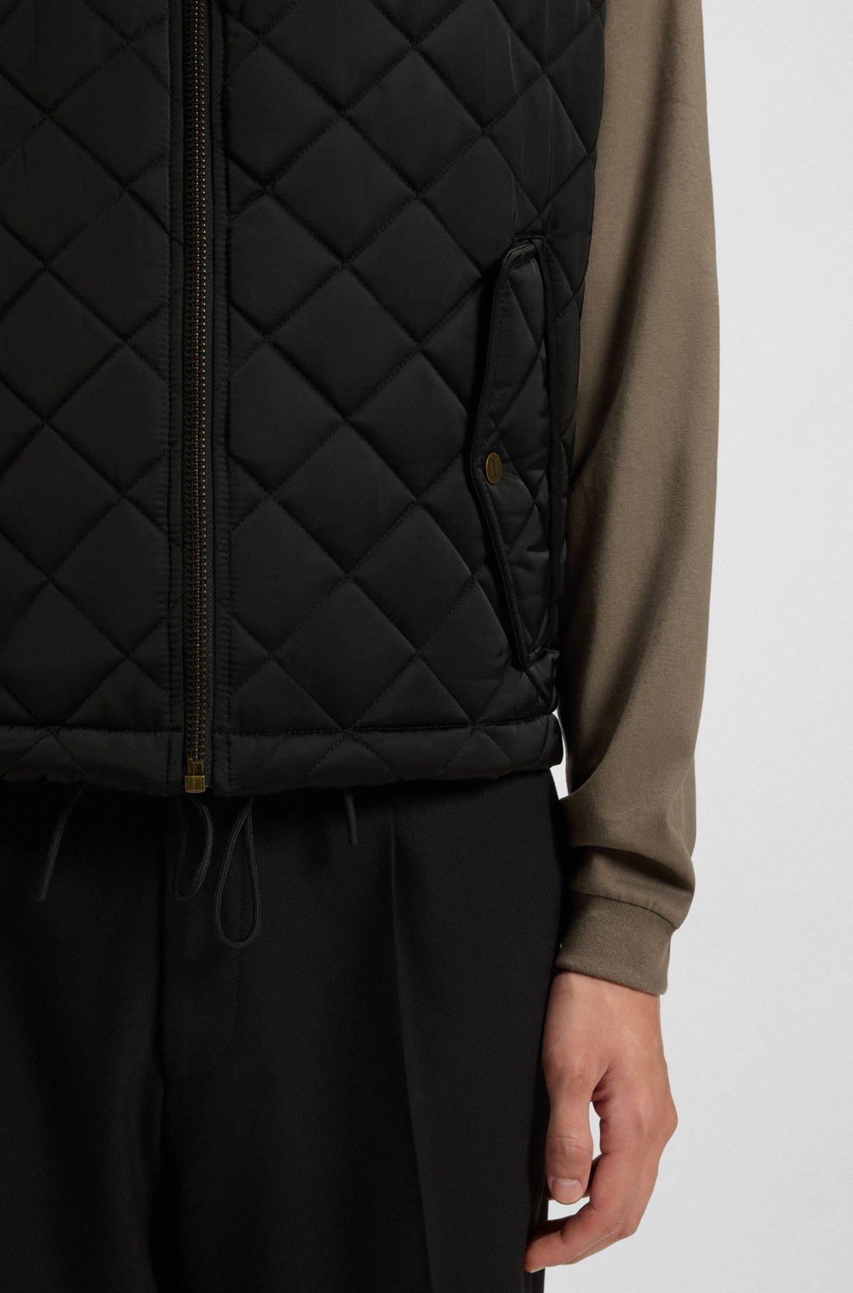 Water-repellent gilet in quilted satin with logo plaque Product Image