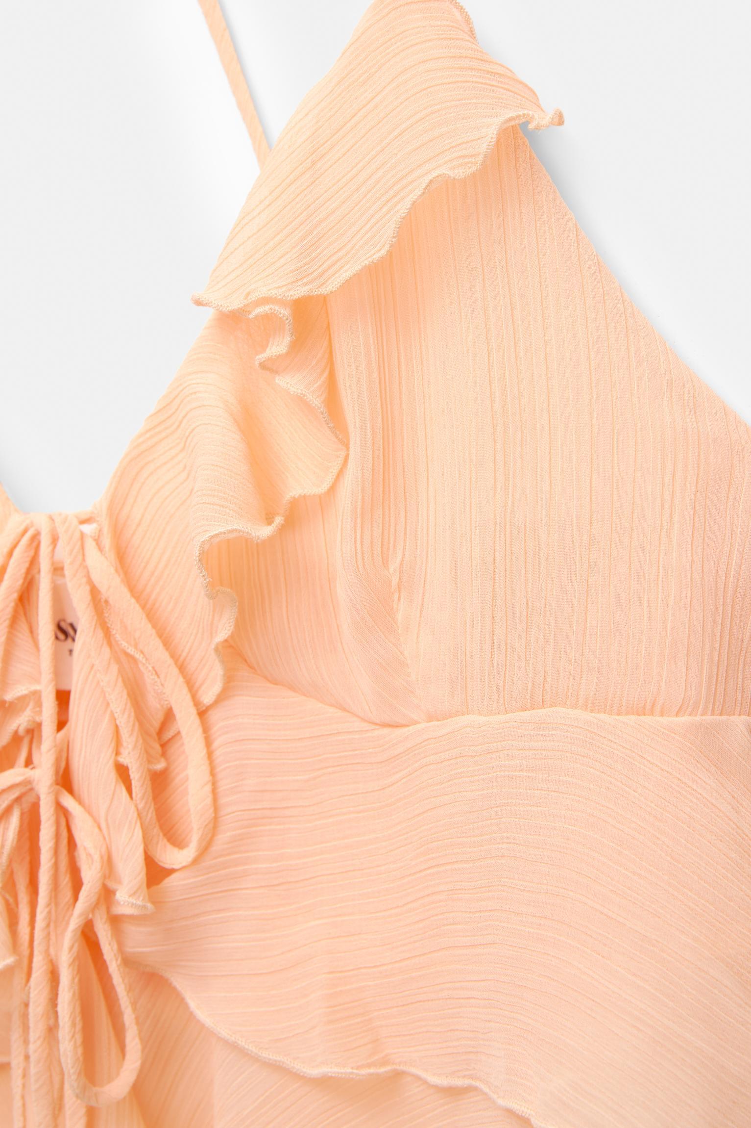 Ruffled top with bow Product Image