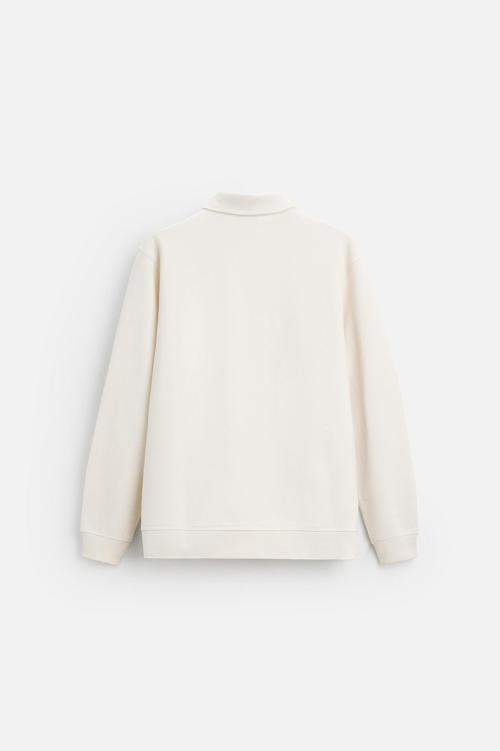 INTERLOCK POLO QUARTER-ZIP SWEATSHIRT Product Image