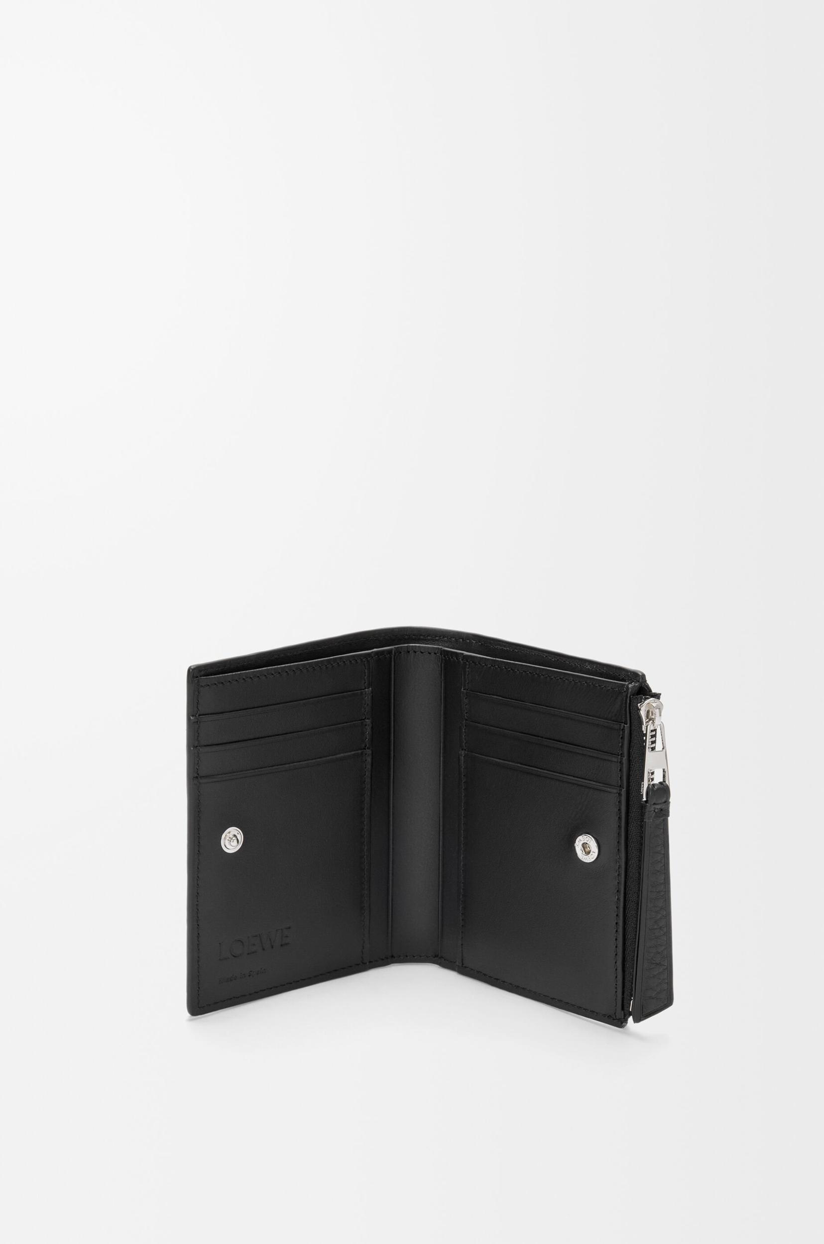 Puzzle slim compact wallet in supple grained calfskin Product Image