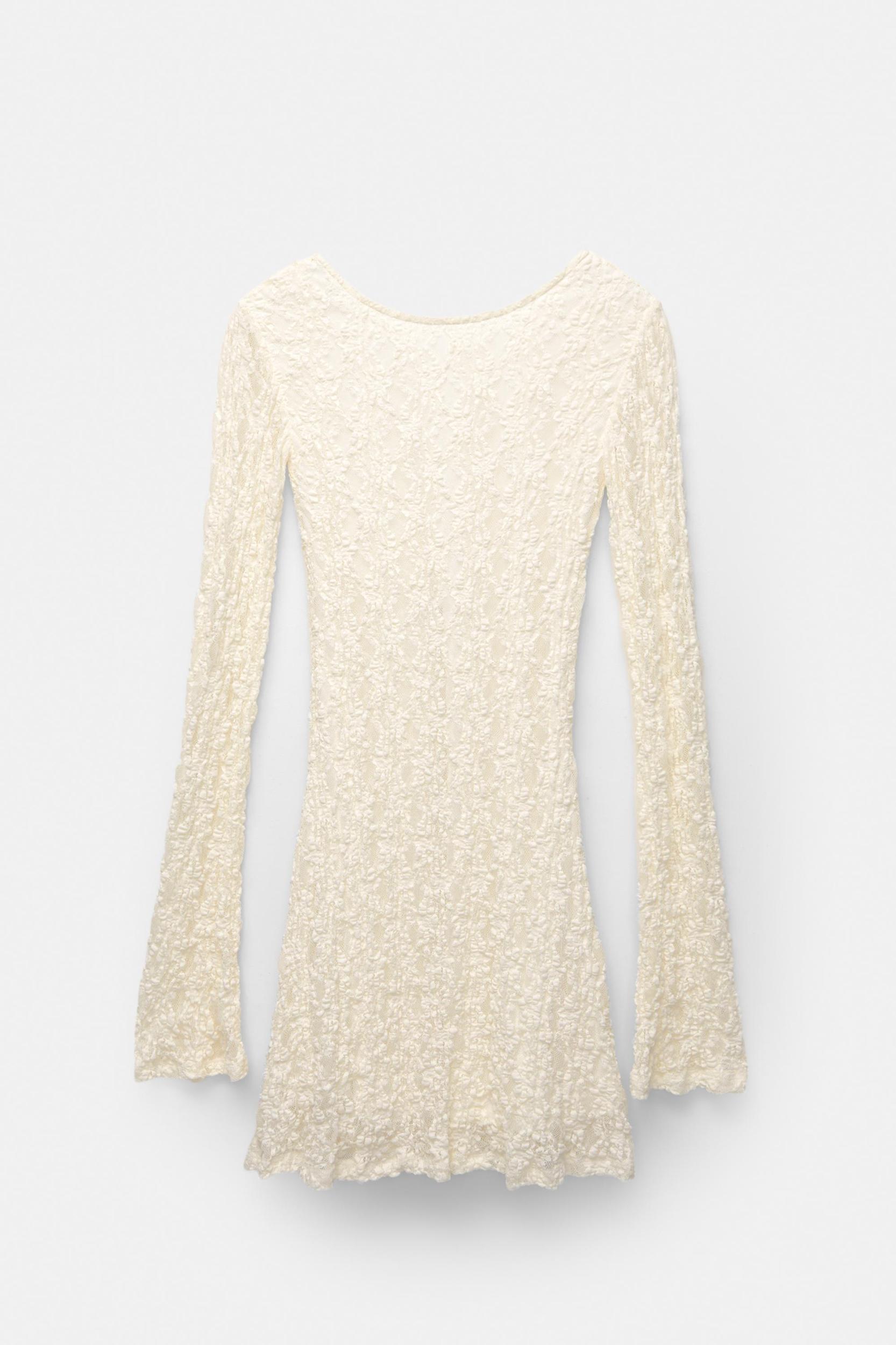 Short lace dress with long sleeves Product Image