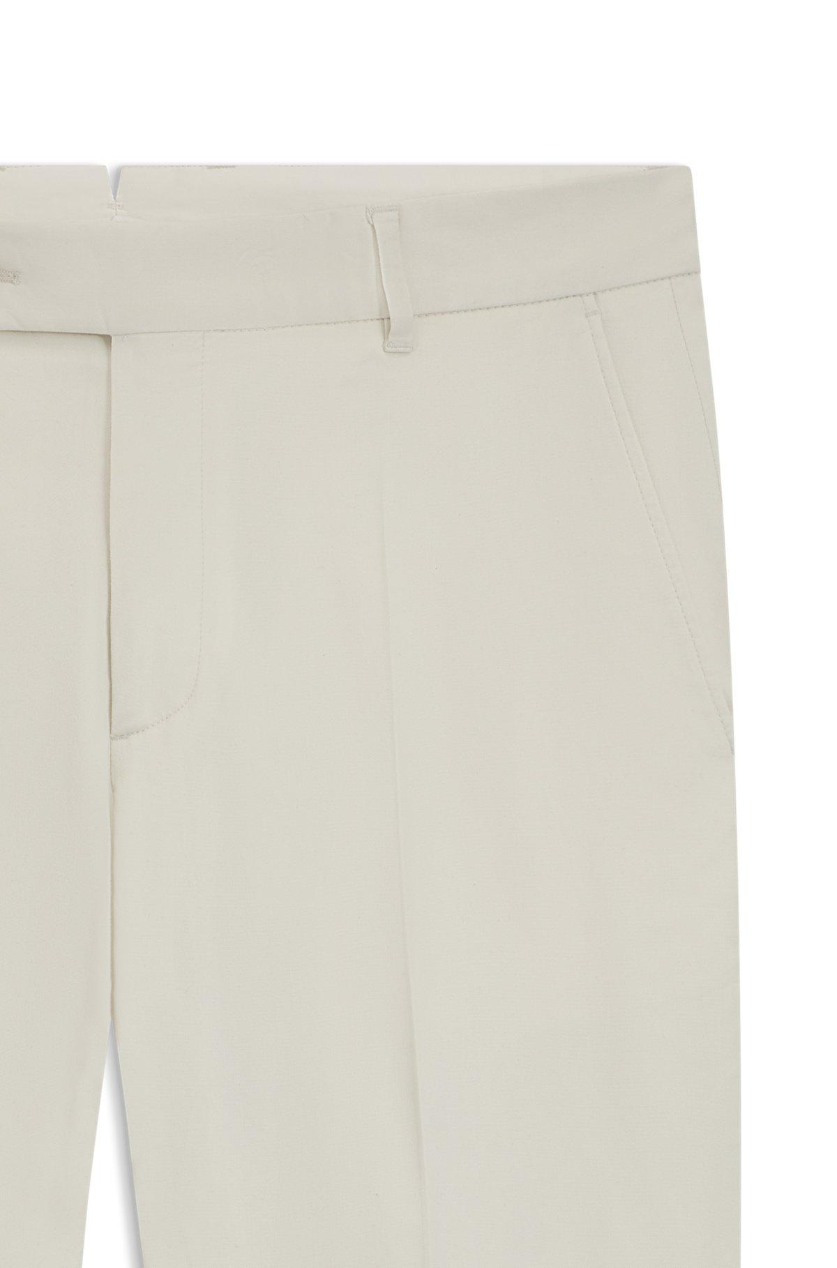 Machine-washable tapered-fit trousers in stretch fabric Product Image