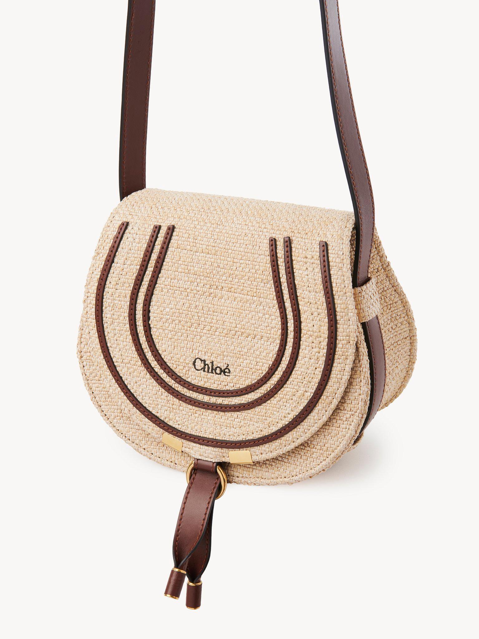 Small Marcie saddle bag in raffia-effect fibers  Product Image