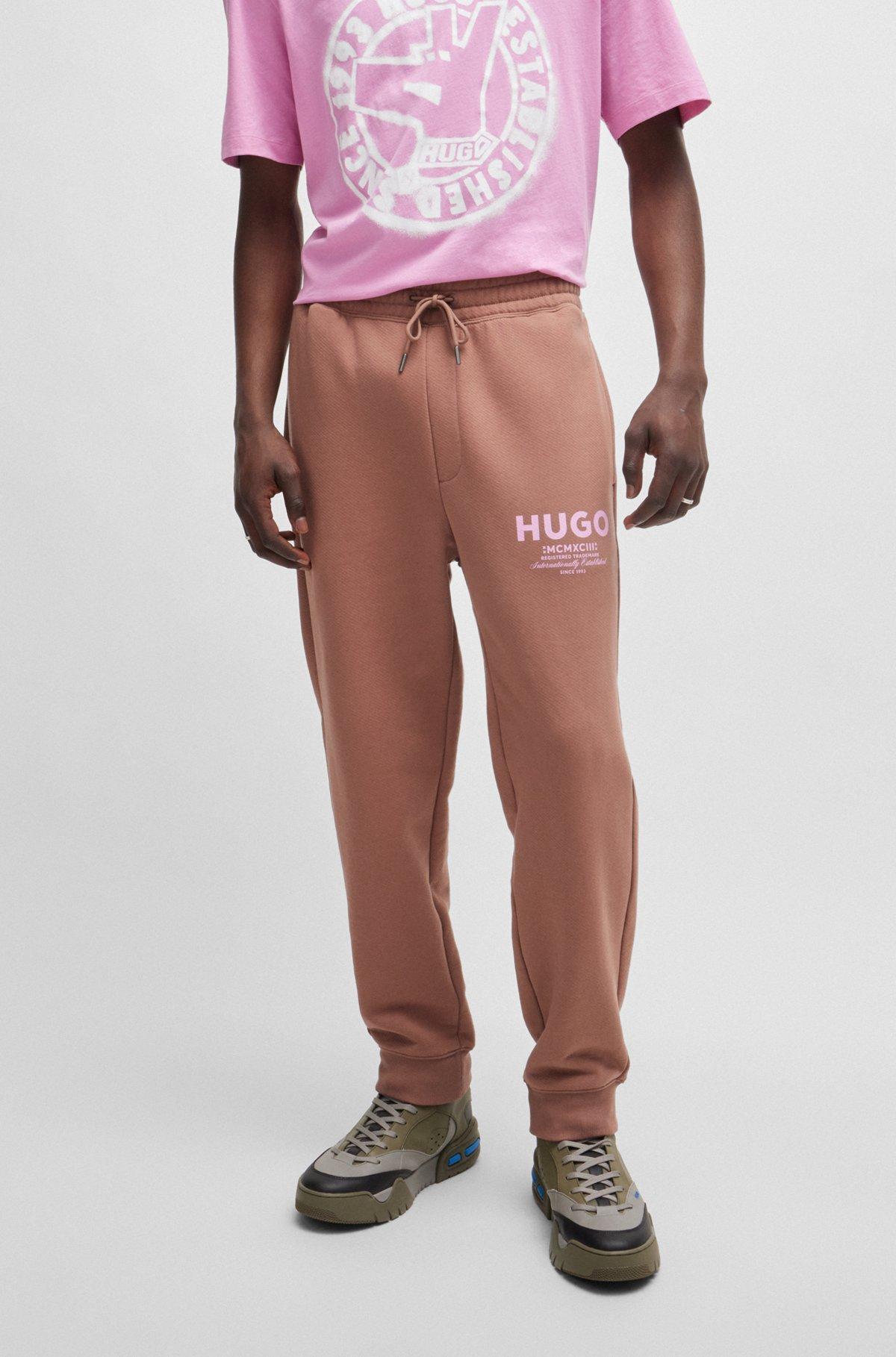 Cotton-terry tracksuit bottoms with logo print Product Image