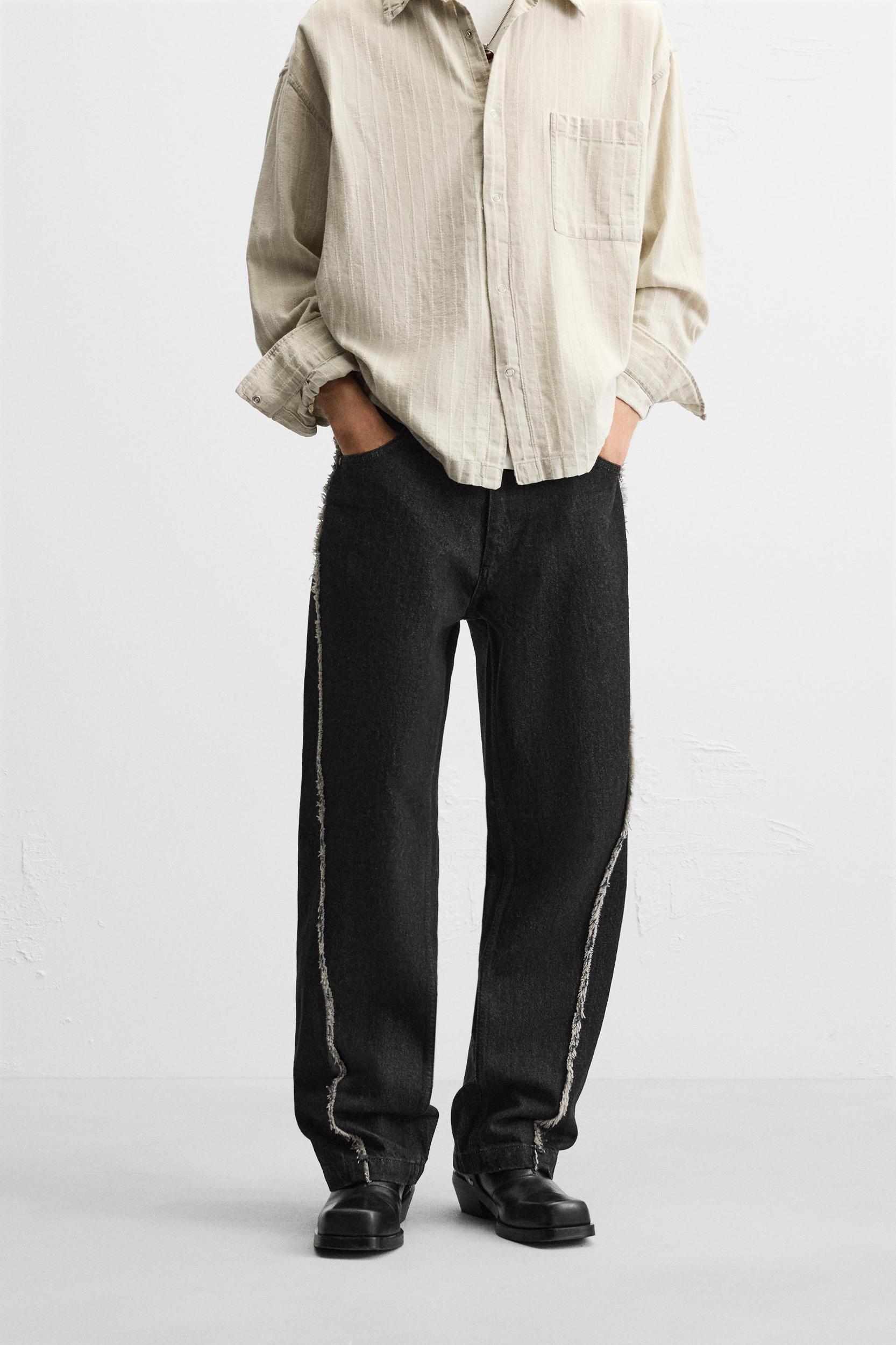 RELAXED FIT FRAYED SEAM JEANS Product Image