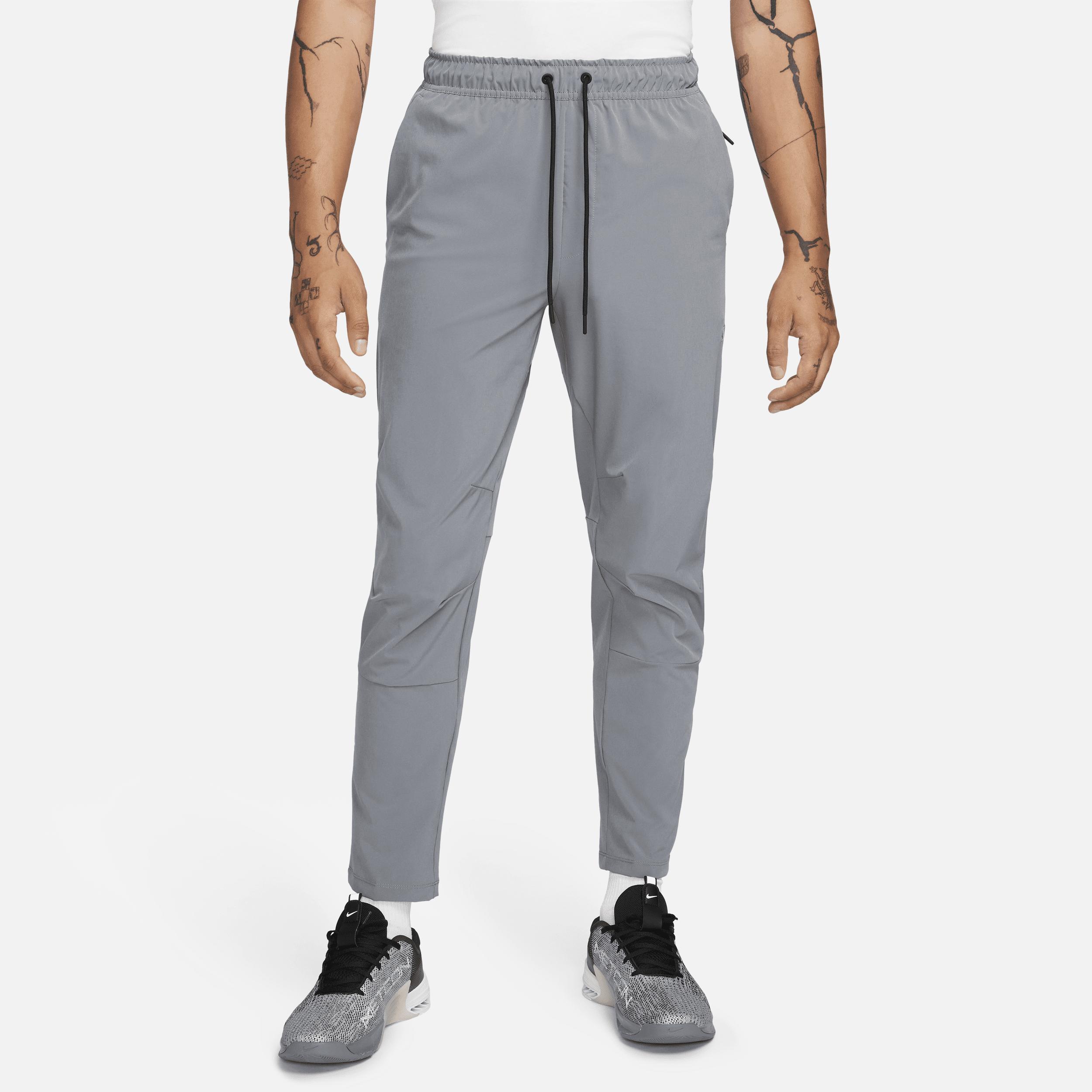 Nike Mens Unlimited Dri-FIT Tapered Leg Versatile Pants | FB7546-084 Product Image