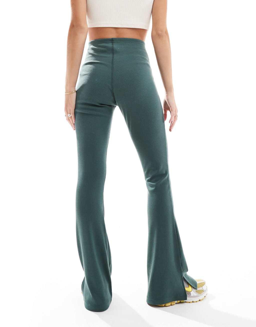 Nike Chill ribbed mid rise flared leggings in dark green Product Image