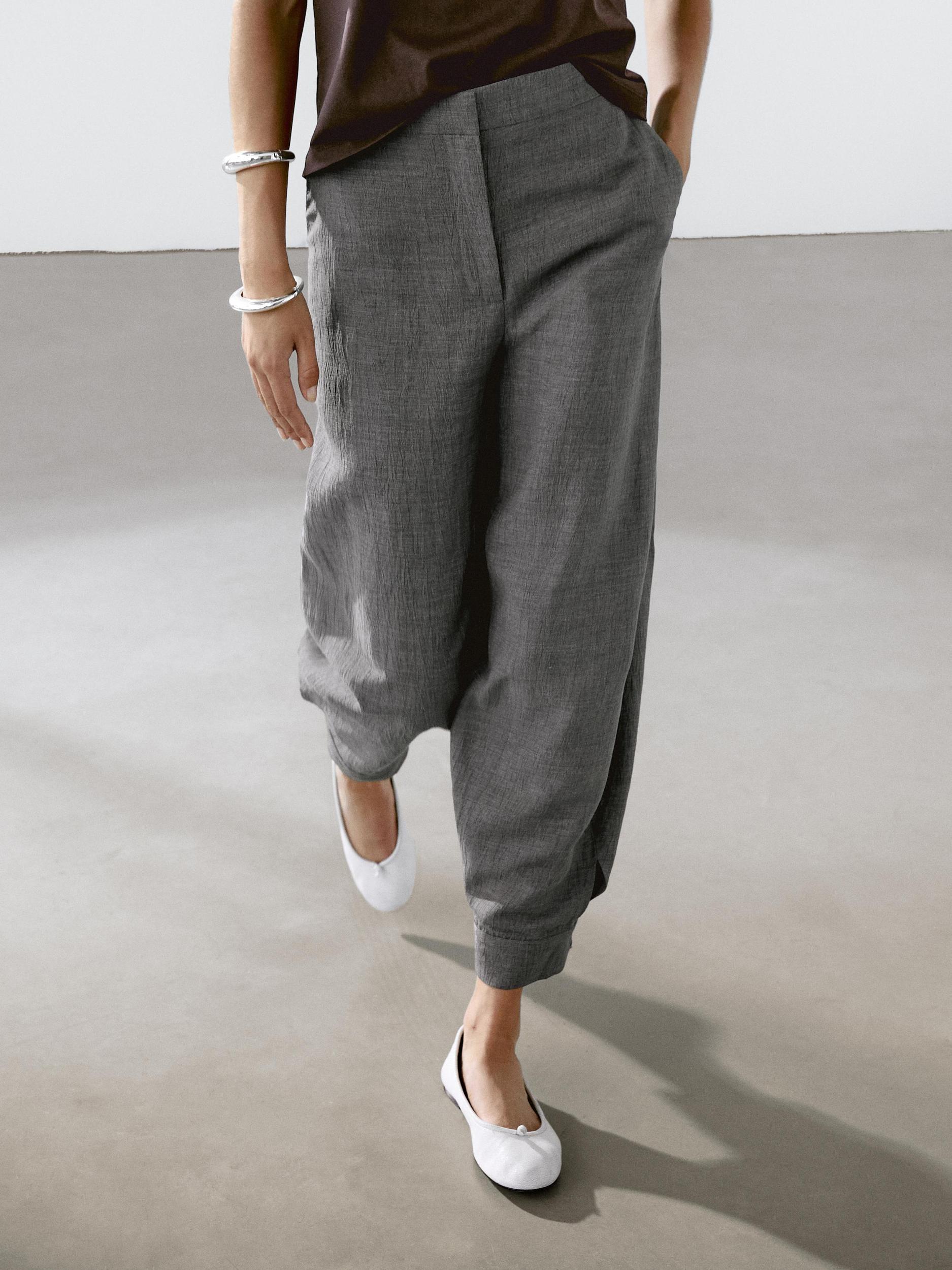 Balloon fit trousers with button details Product Image