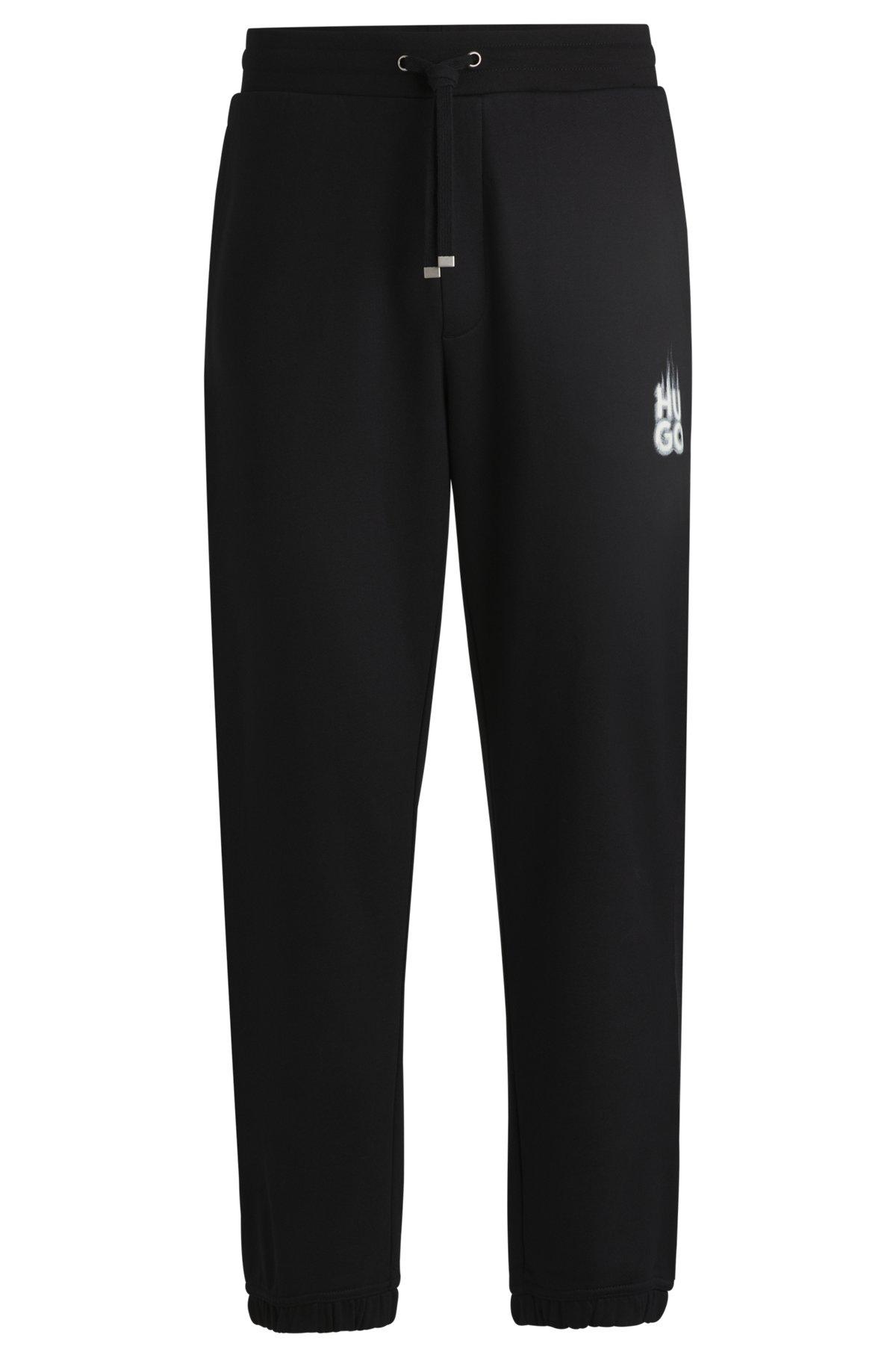 Cotton-terry tracksuit bottoms with smoke logo Product Image