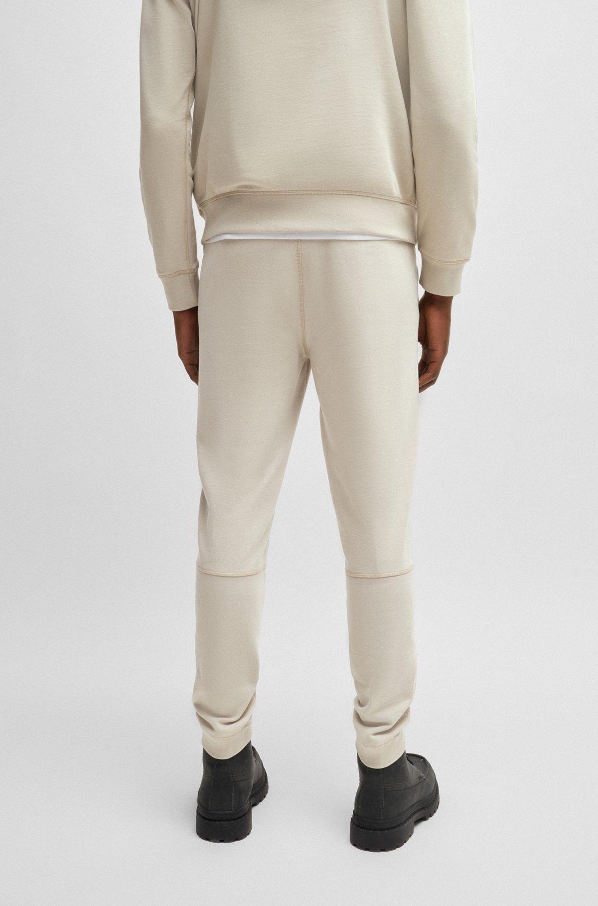 Cotton-terry tracksuit bottoms with logo patch Product Image