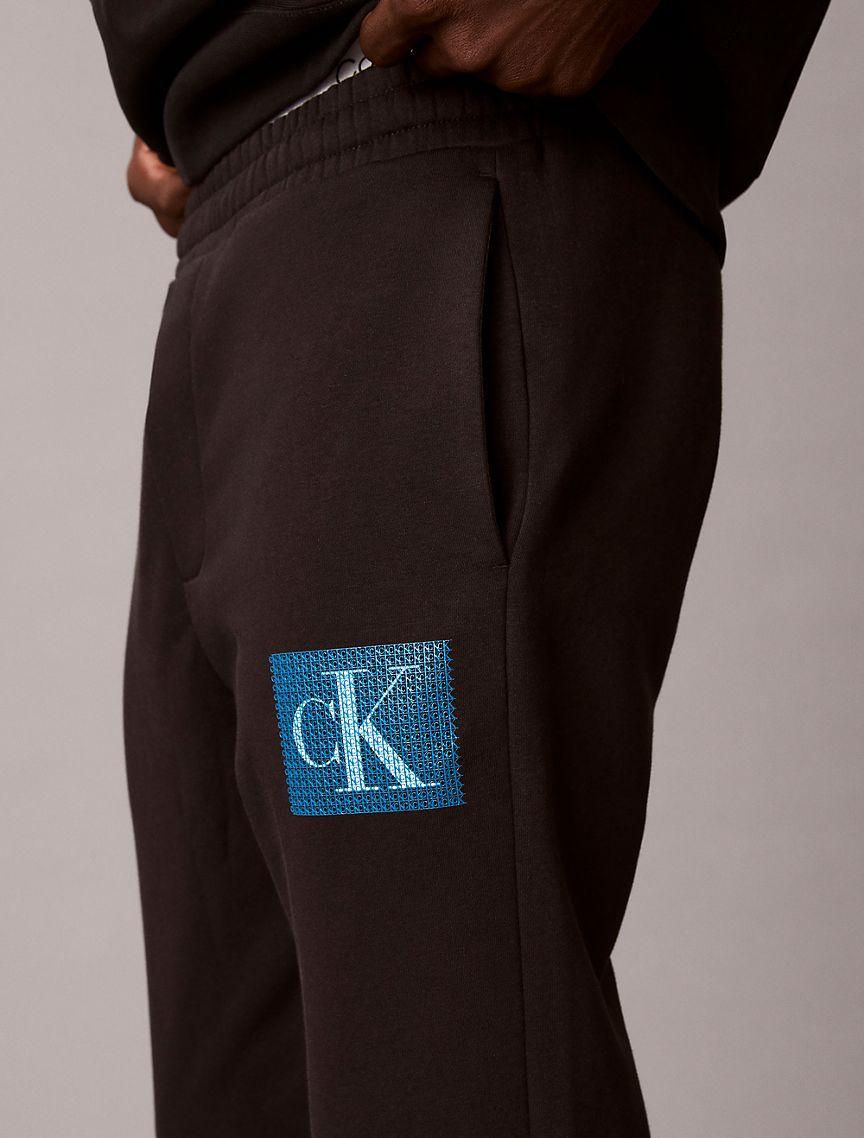 Fleece Layered Monogram Graphic Sweatpants Product Image