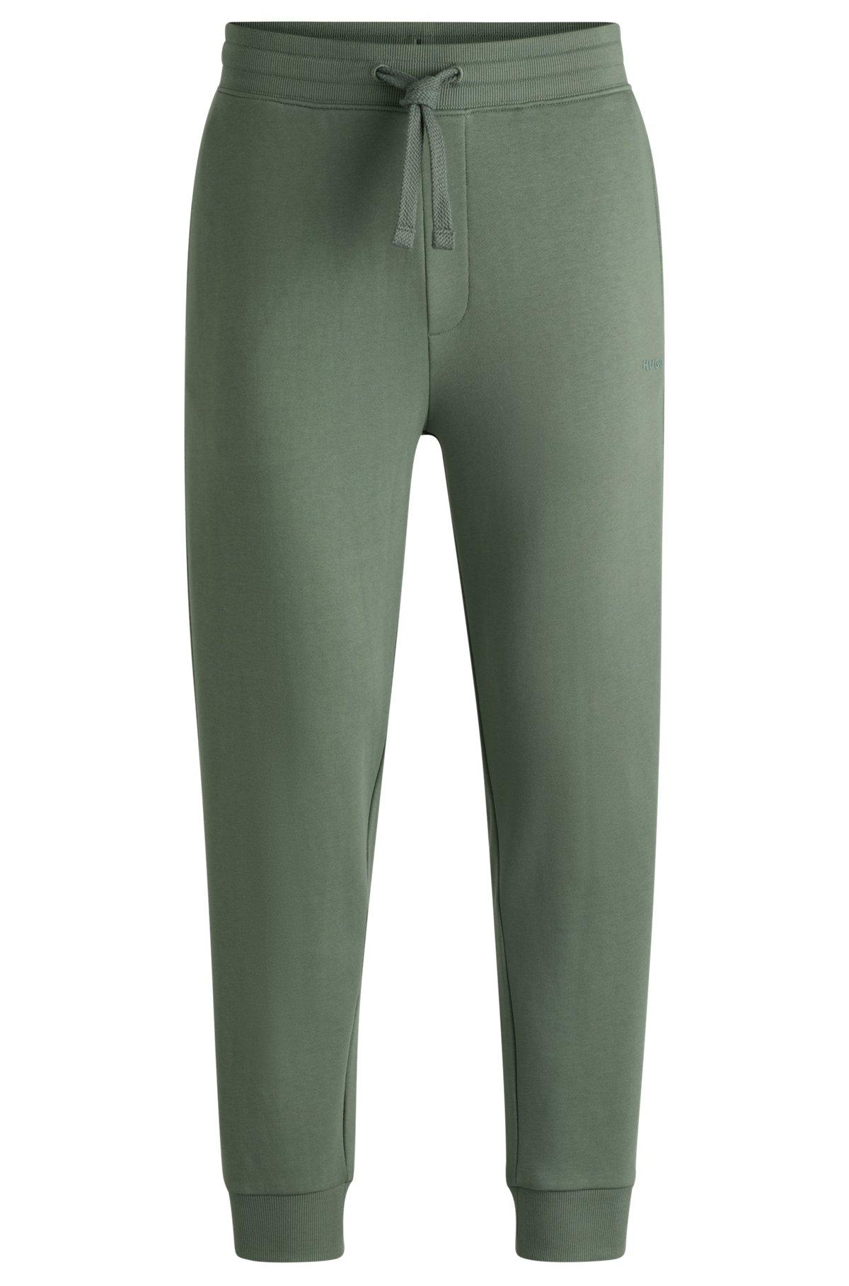 Cuffed tracksuit bottoms in cotton terry with logo print Product Image