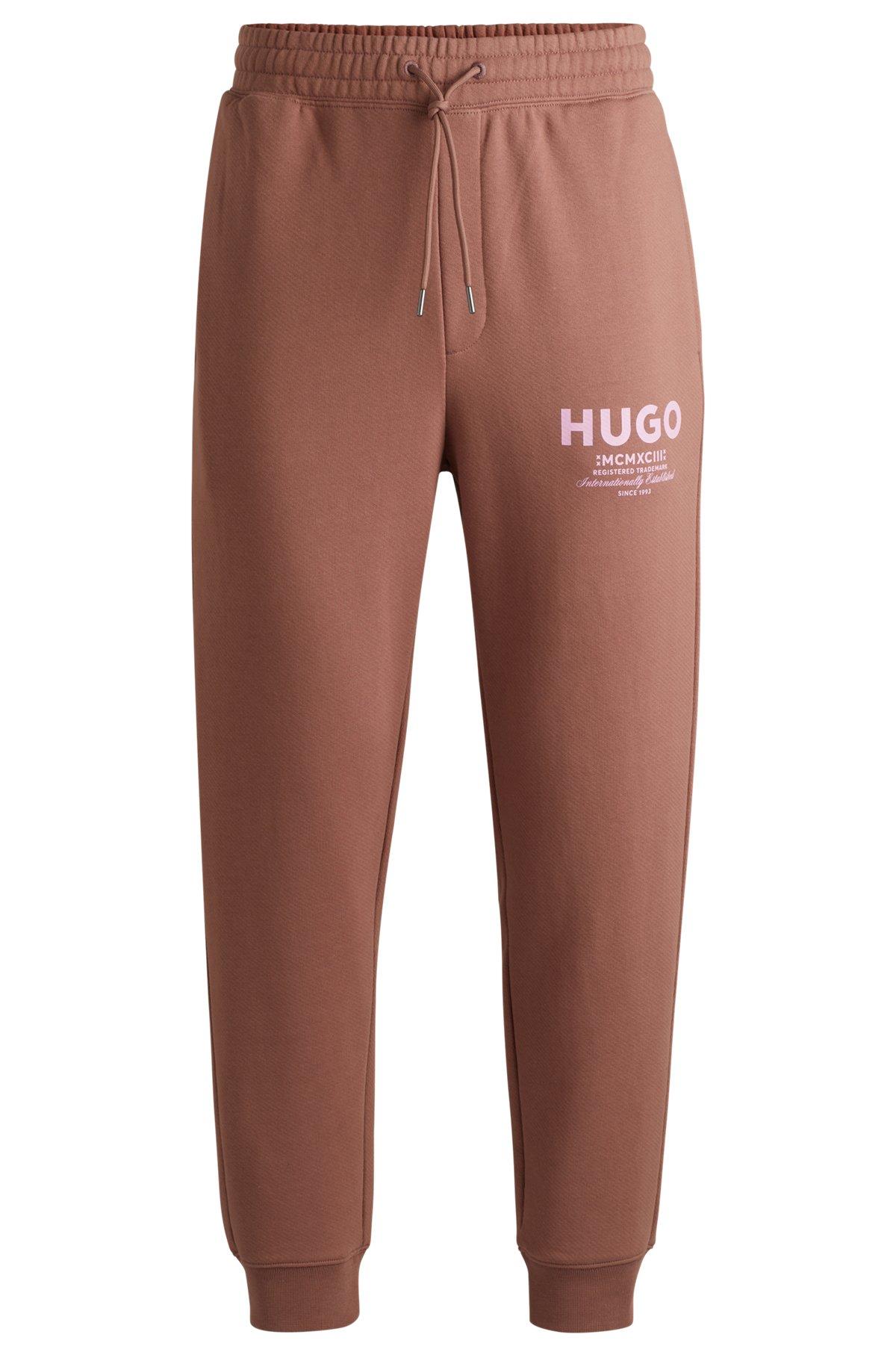 Cotton-terry tracksuit bottoms with logo print Product Image