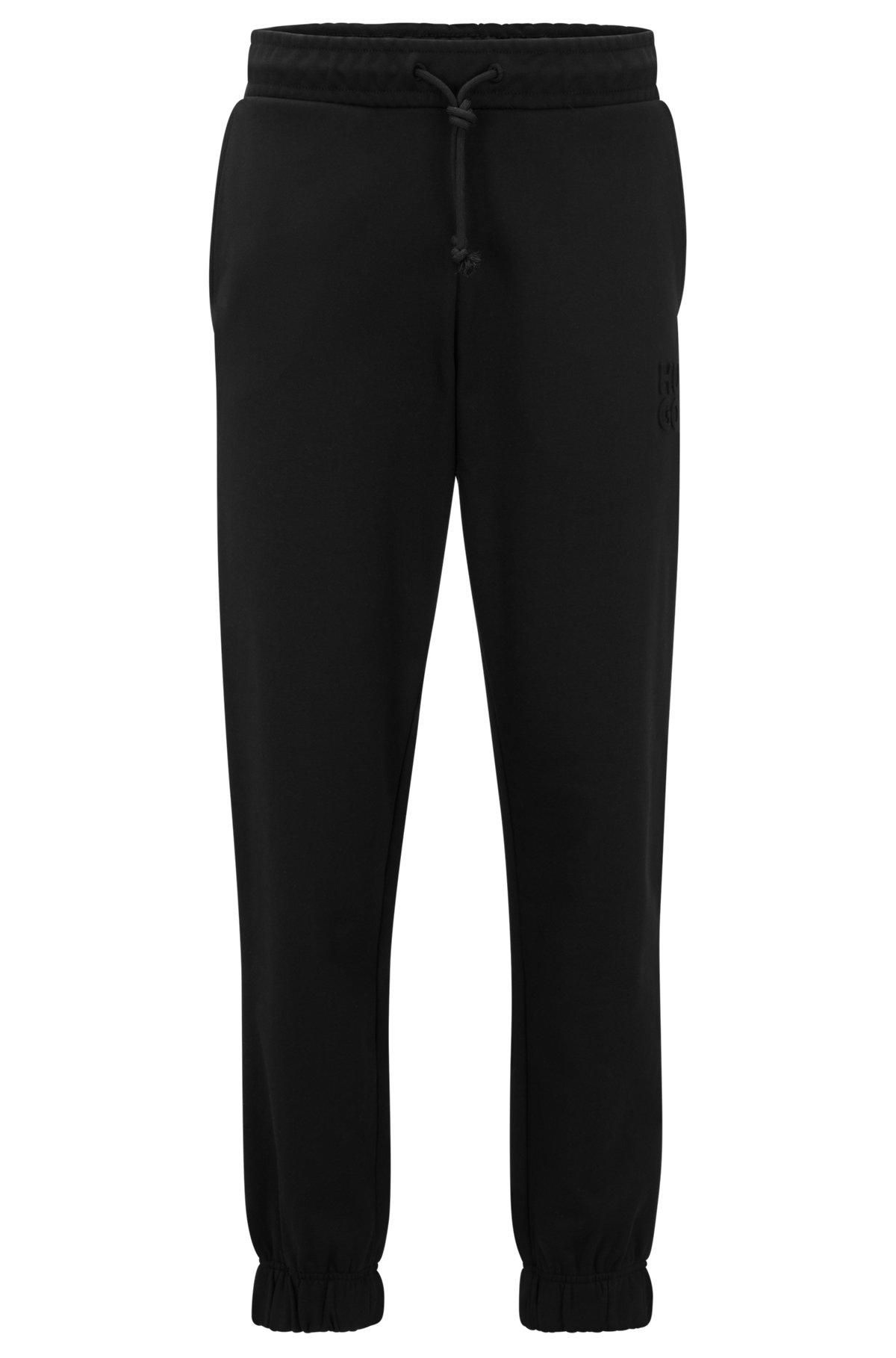 Relaxed-fit cotton-terry tracksuit bottoms with stacked logo Product Image