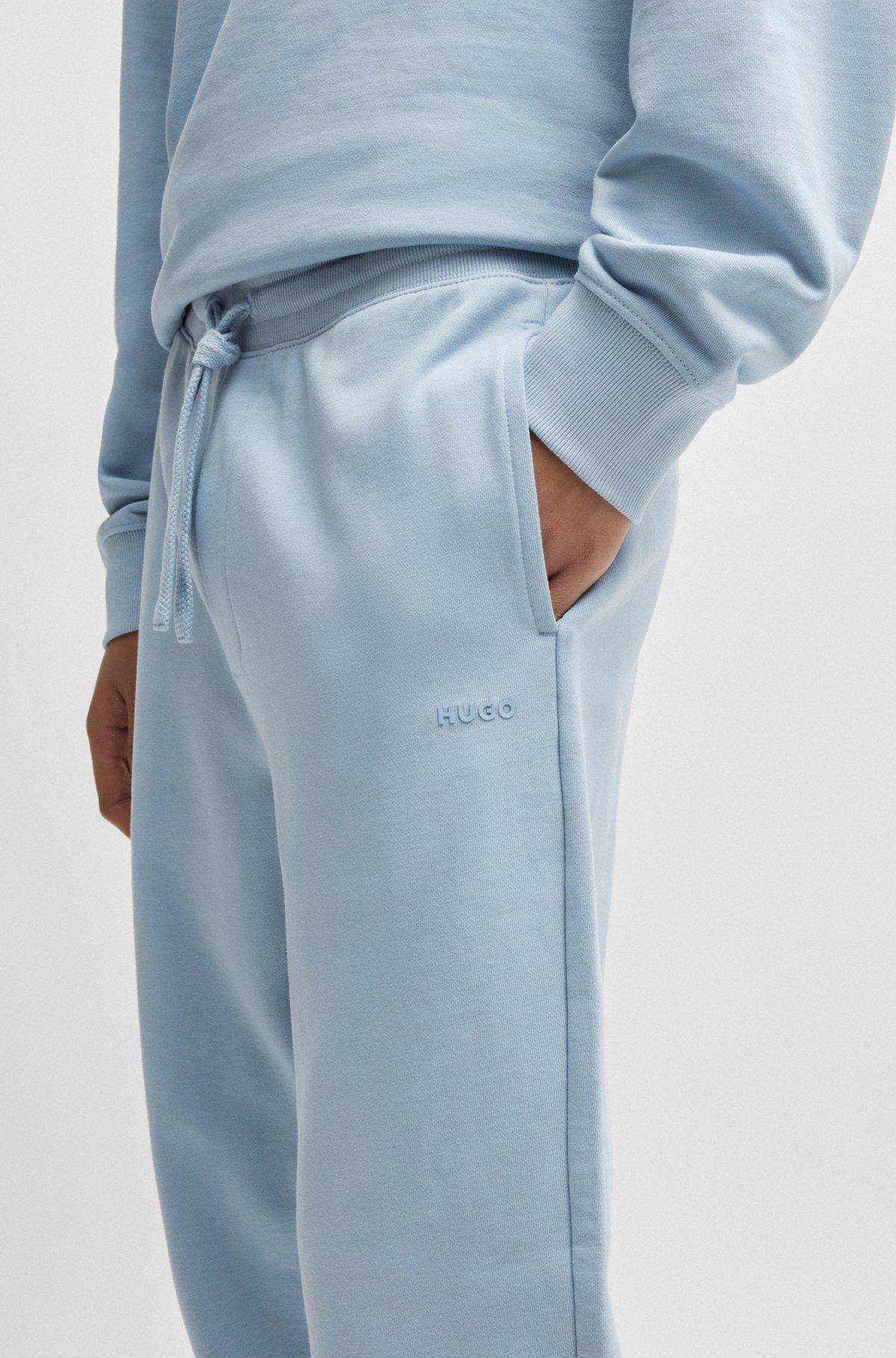 Cuffed tracksuit bottoms in cotton terry with logo print Product Image