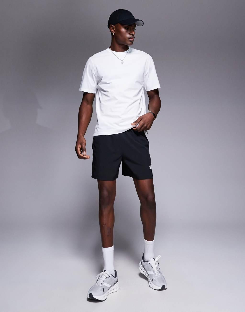 4505 7 inch wide leg quick dry graphic training shorts with towel loop and zip pockets in black  Product Image