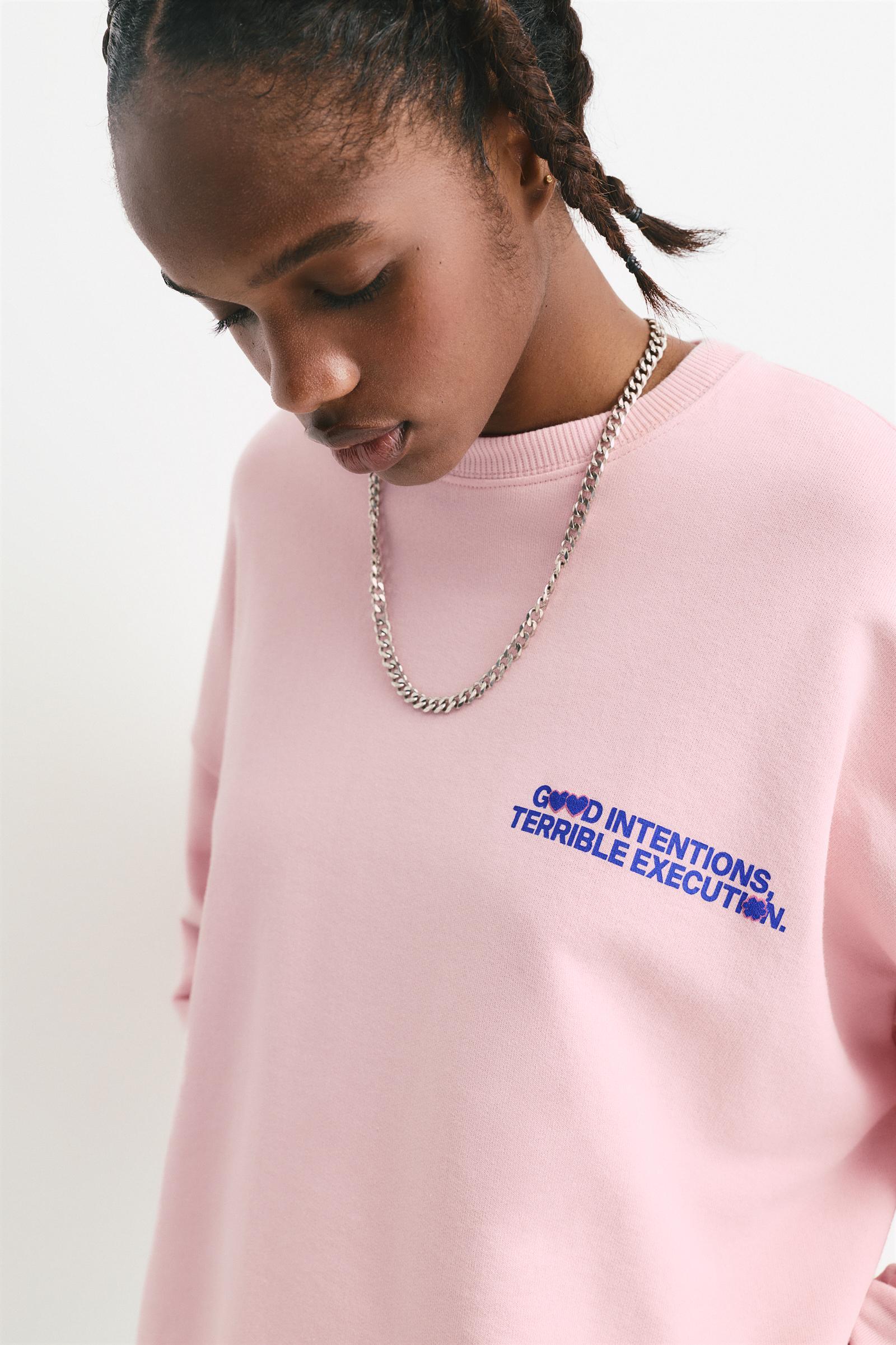 Pink sweatshirt with slogan Product Image