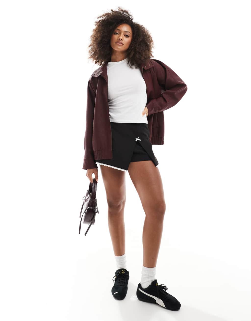 Miss Selfridge tailored mini skort with bow in black Product Image