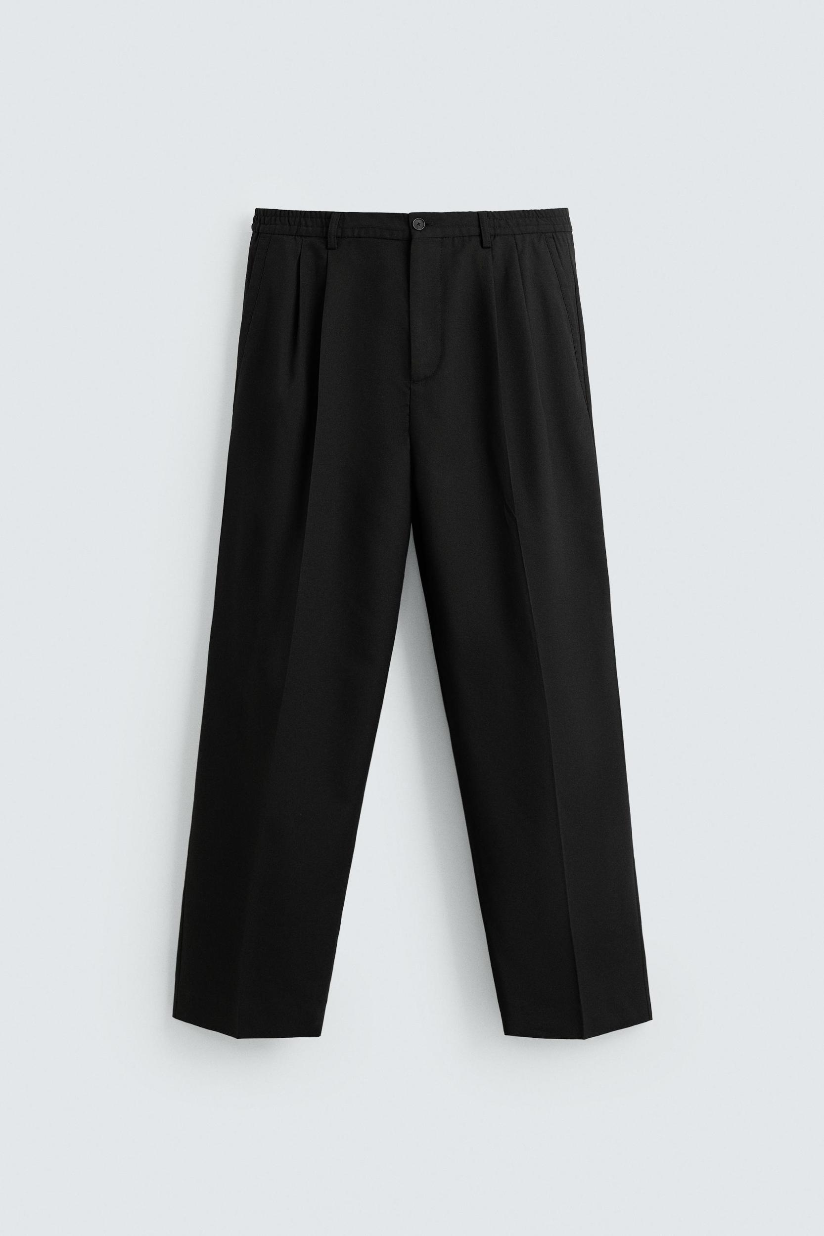 FLOWY PLEATED WIDE FIT PANTS Product Image