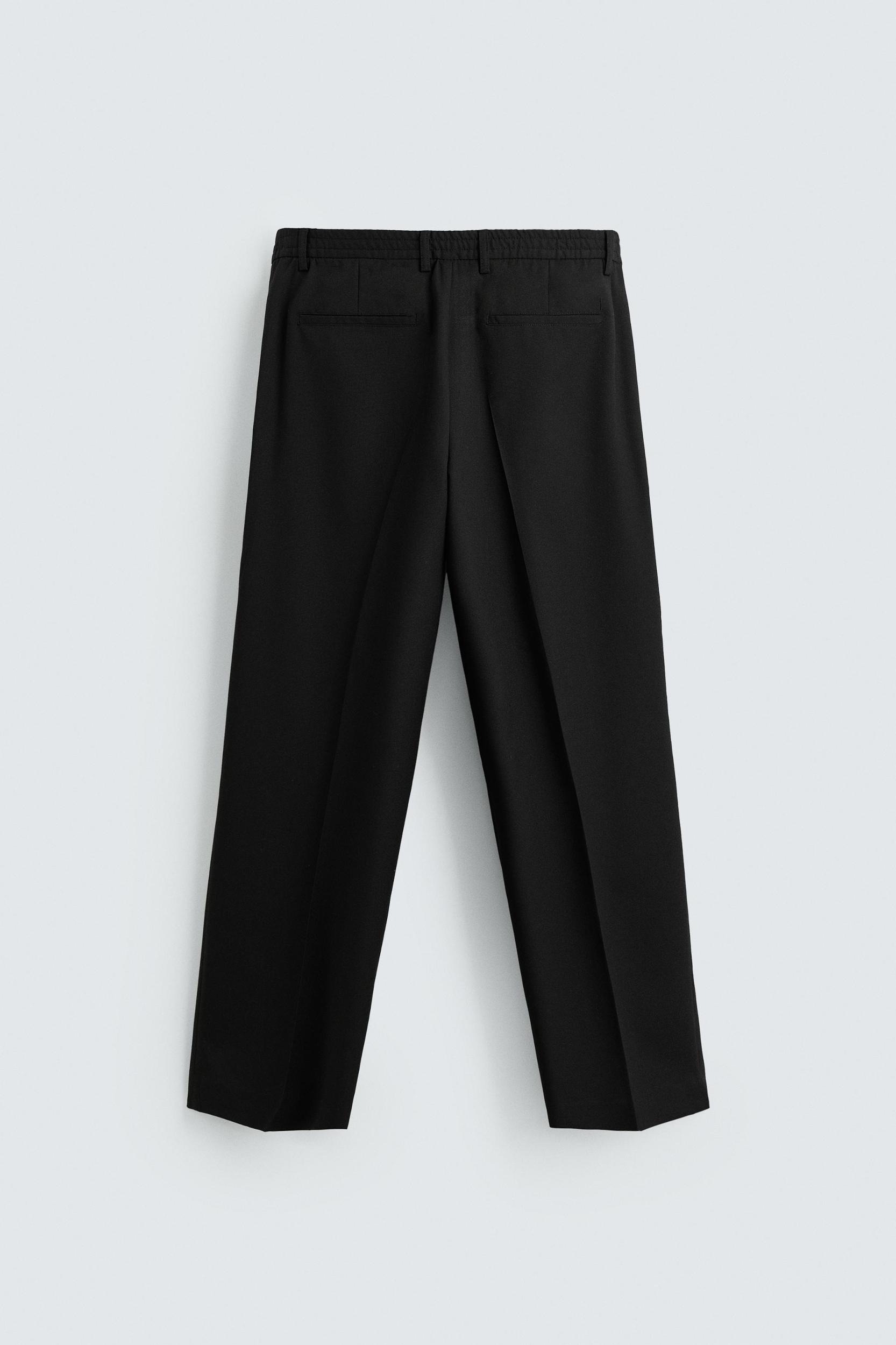 FLOWY PLEATED WIDE FIT PANTS Product Image