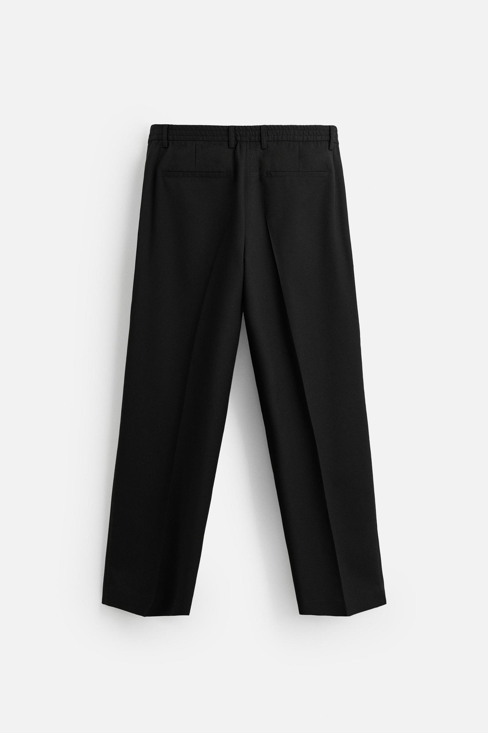 FLOWY PLEATED WIDE FIT PANTS Product Image