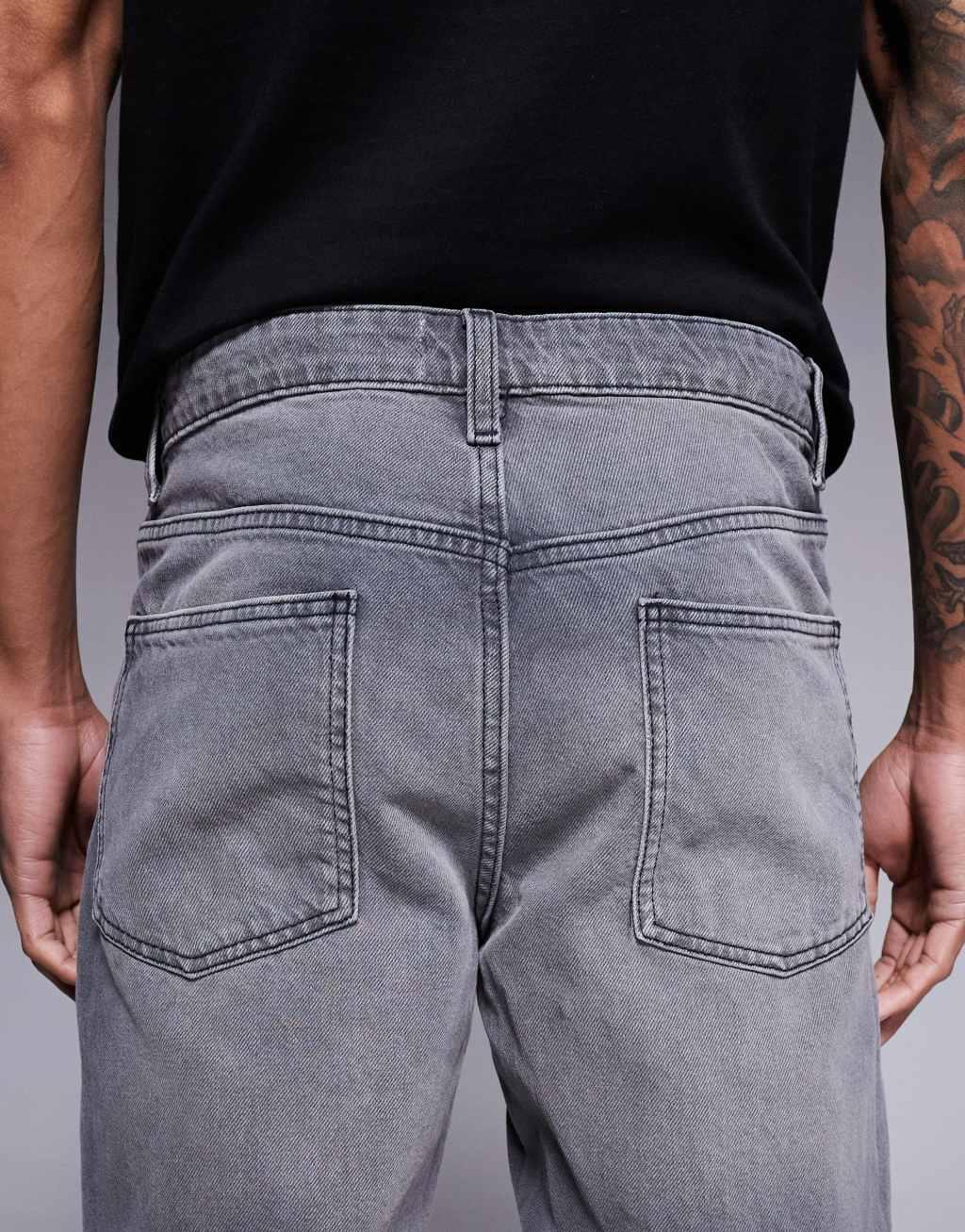 ASOS DESIGN tapered fit jeans in washed black  Product Image