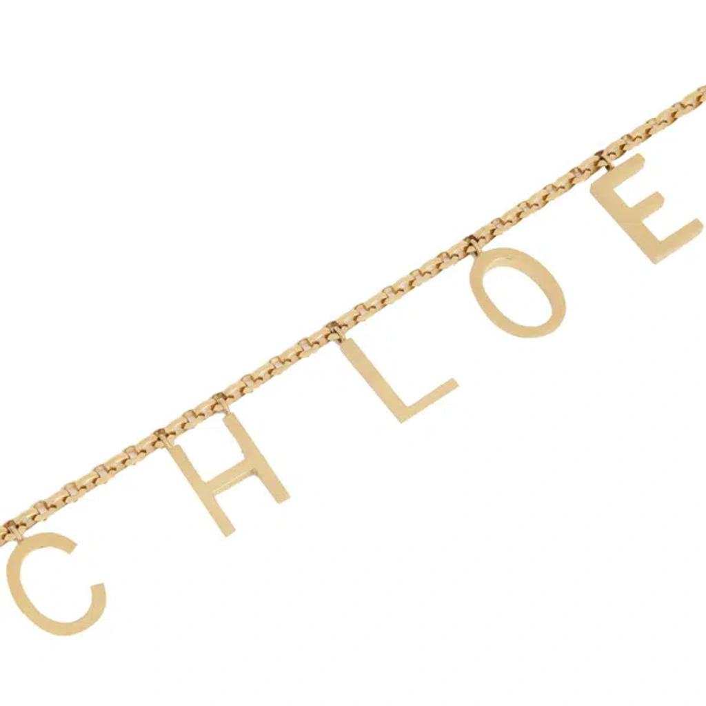 CHLOÉ Metallic Belt With Adjustable Hook Closure And Logo Lettering Charm In Brass Woman In Gold Product Image