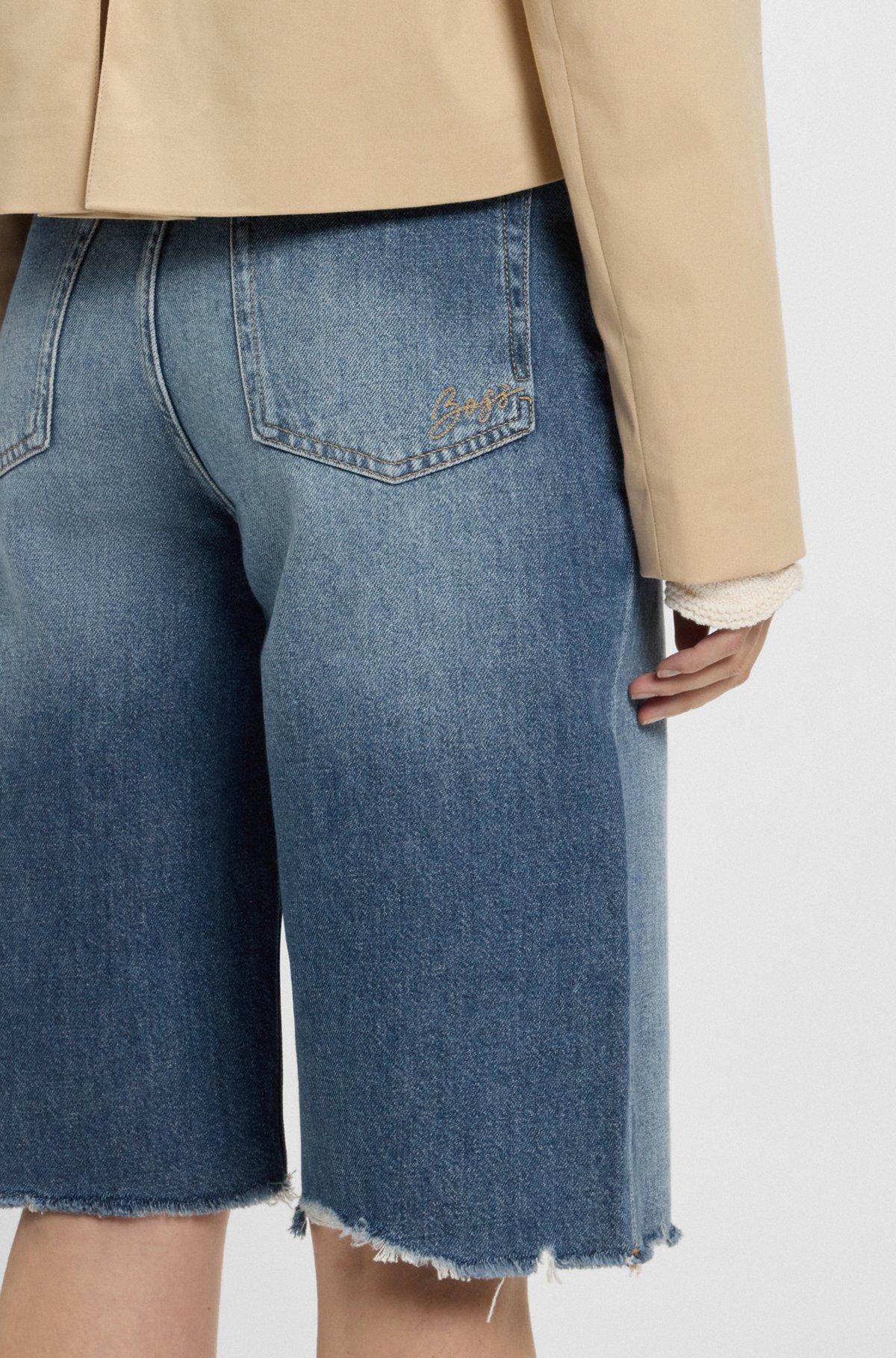 Knee-length denim shorts with raw hem Product Image