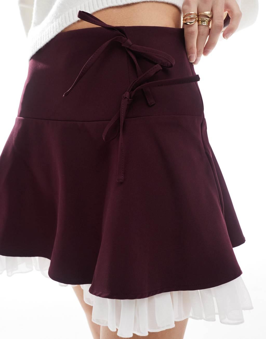 Miss Selfridge flippy mini skirt with bows in burgundy Product Image