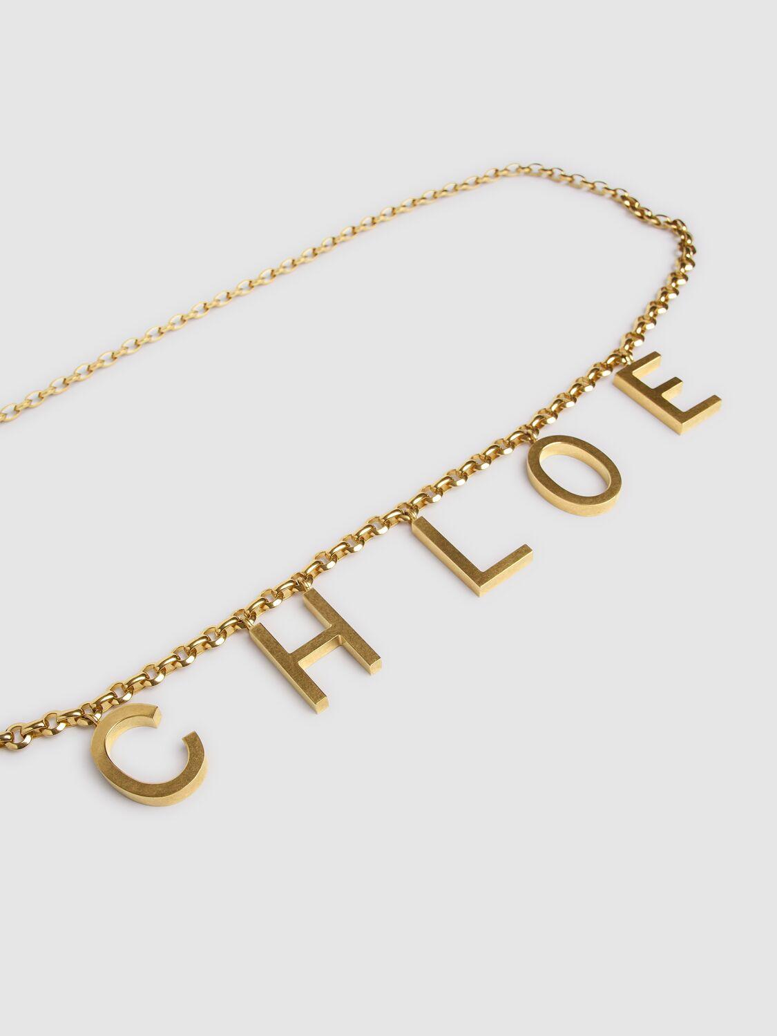 CHLOÉ Metallic Belt With Adjustable Hook Closure And Logo Lettering Charm In Brass Woman In Gold Product Image