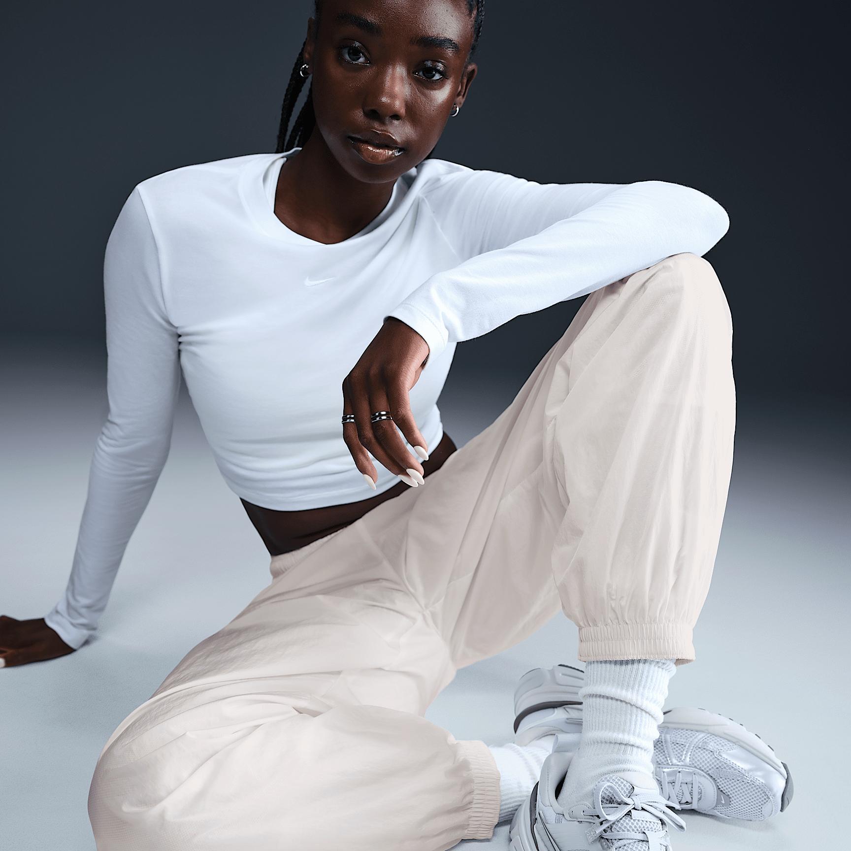 Womens Nike Sportswear Essential Mid-Rise Oversized Woven Jogger Pants | FV7668-004 Product Image