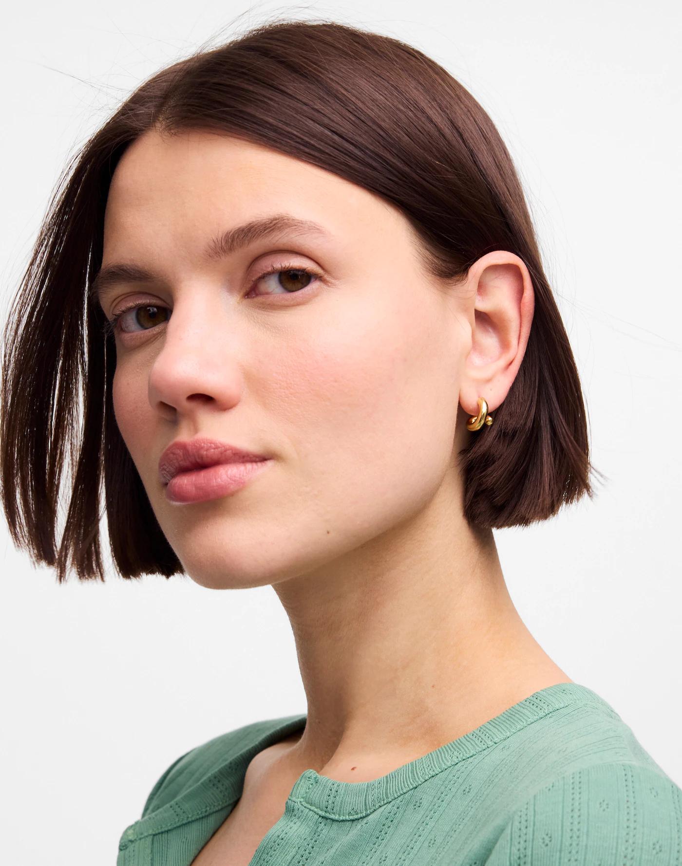 Demi-Fine Twisted Huggie Hoop Earrings Product Image