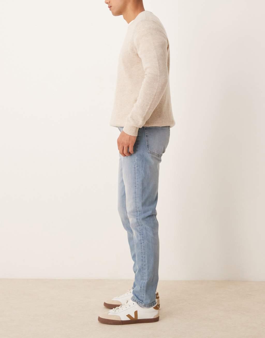 ASOS DESIGN skinny jeans in light wash blue Product Image