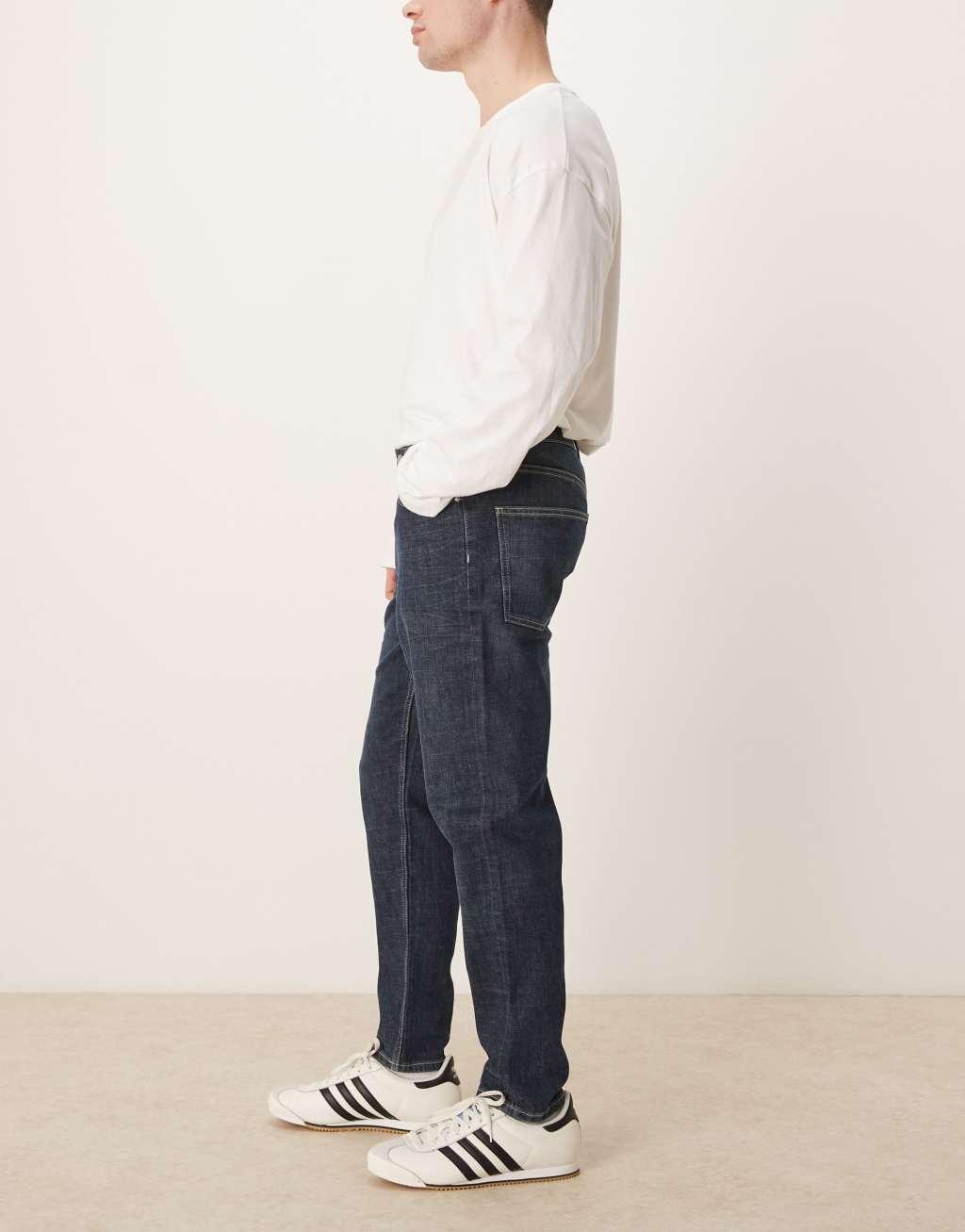 ASOS DESIGN stretch tapered jeans in dark wash blue Product Image