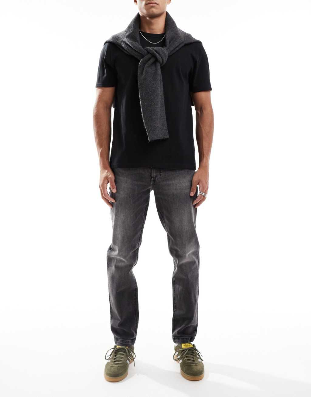 ASOS DESIGN stretch tapered jeans in washed black Product Image