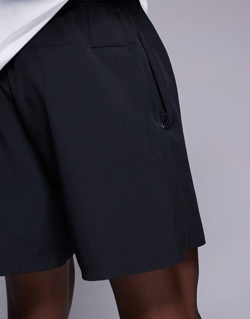 4505 7 inch wide leg quick dry graphic training shorts with towel loop and zip pockets in black  Product Image